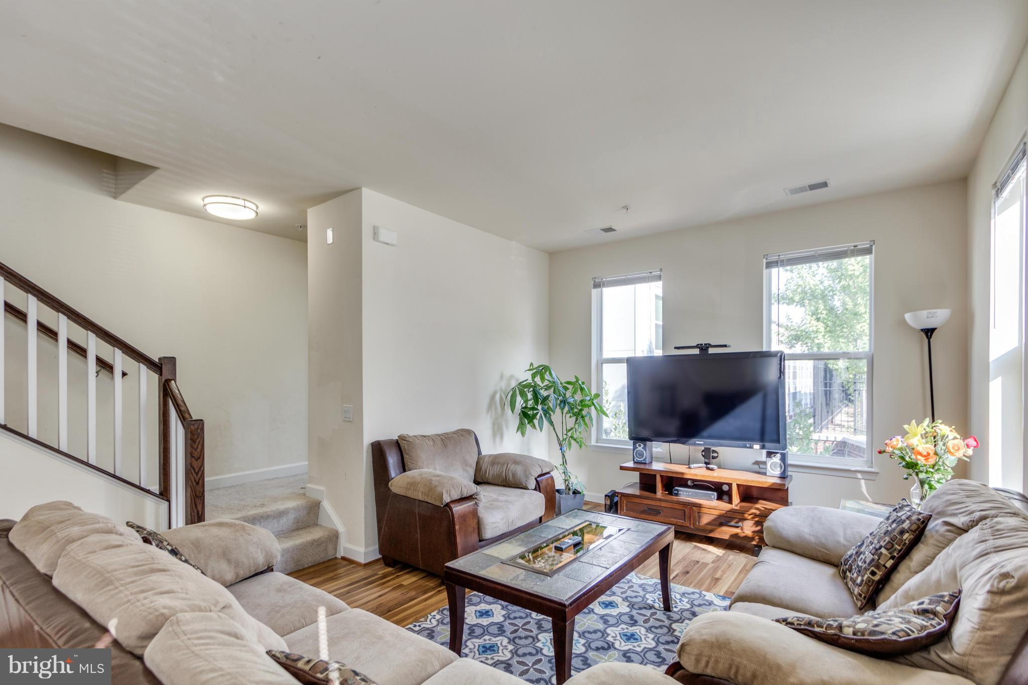 2524 Sheridan Road Southeast Washington, DC 20020 - Photo 6 of 20 a living room with furniture and a flat screen tv