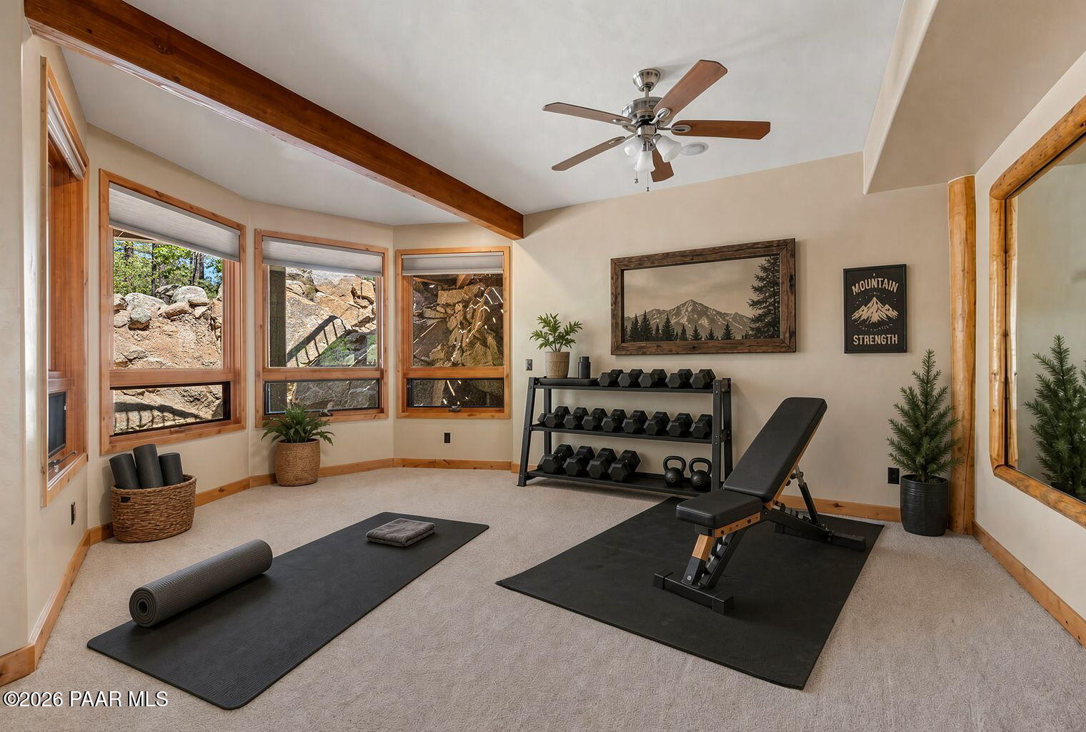 5140 East Charcoal Kiln Road Prescott, AZ 86303 - Photo 84 of 140 a living room with furniture gym equipment and a large window