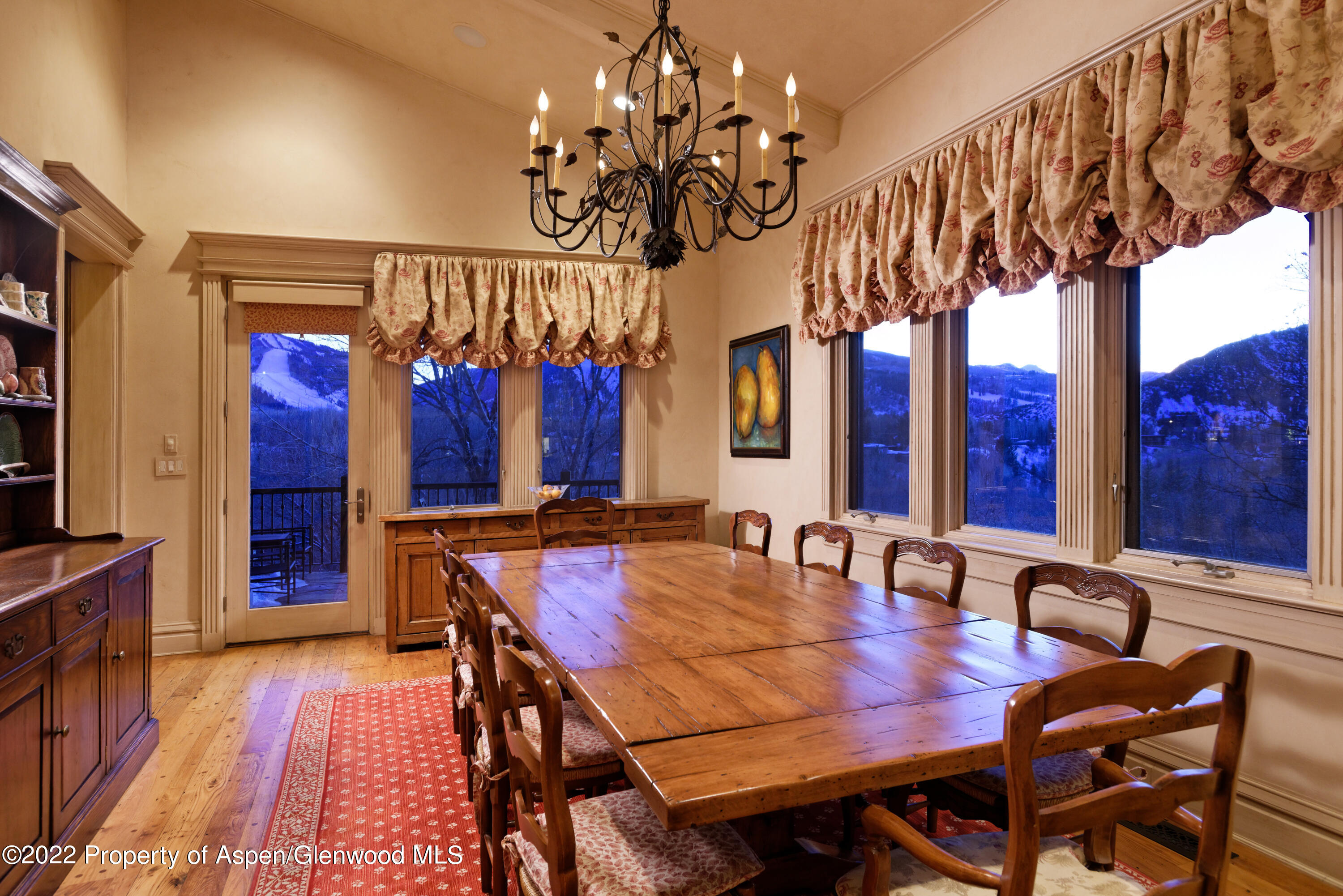 926 Willoughby Way Aspen, CO 81612 - Photo 11 of 47 a view of a dining room with furniture window and wooden floor