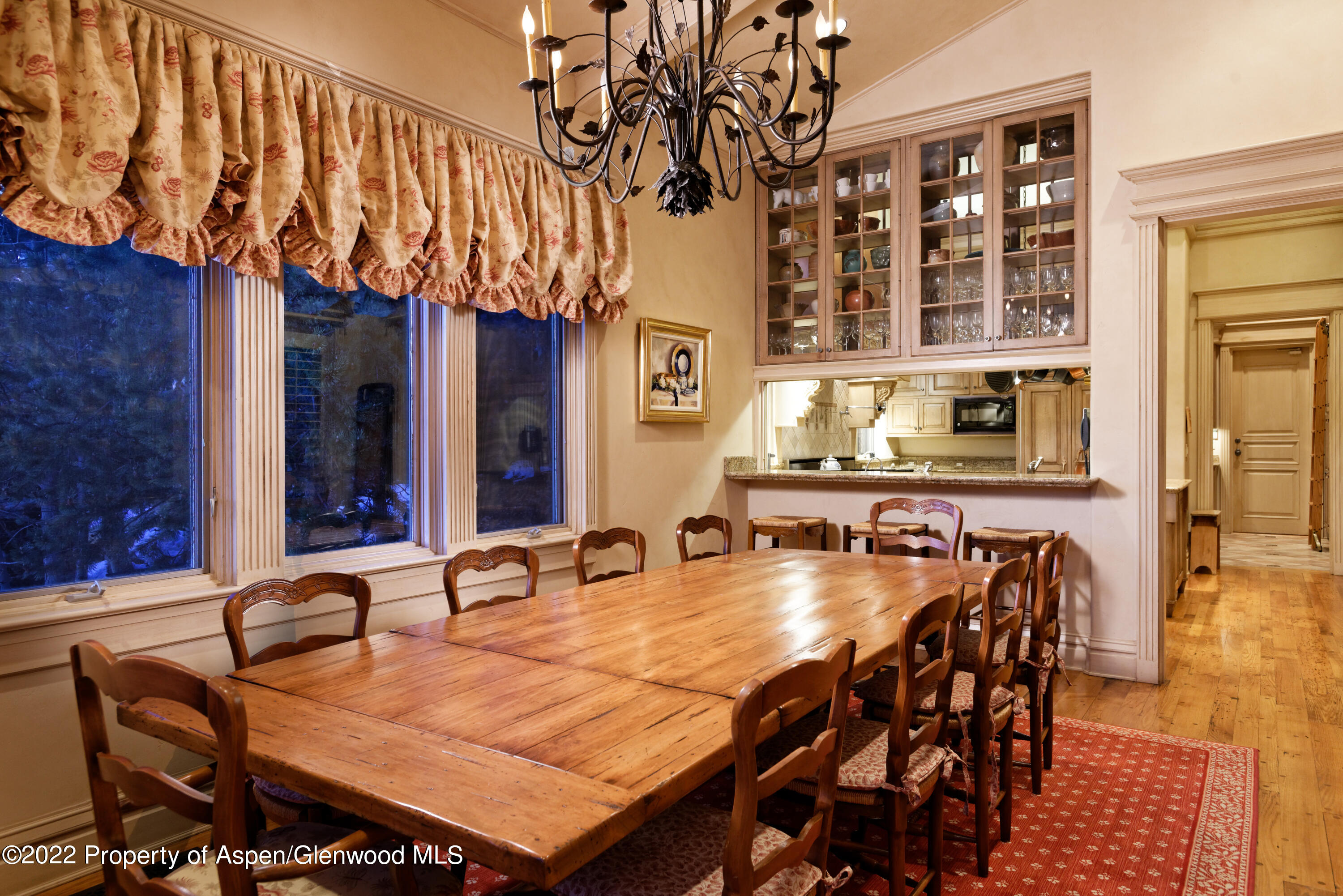 926 Willoughby Way Aspen, CO 81612 - Photo 12 of 47 a dining room with chairs and wooden floor
