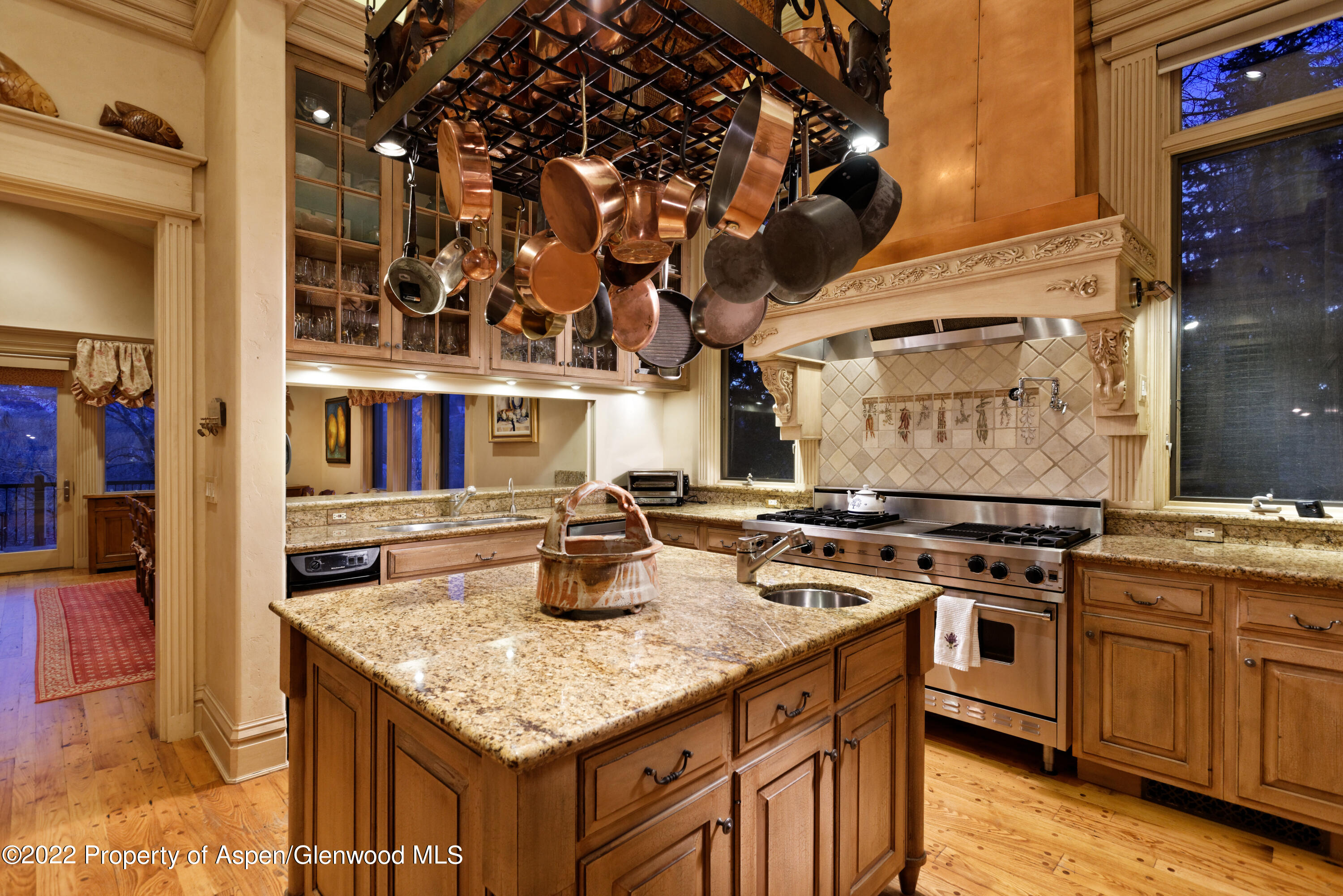 926 Willoughby Way Aspen, CO 81612 - Photo 14 of 47 a kitchen with stainless steel appliances granite countertop a stove a sink and a refrigerator