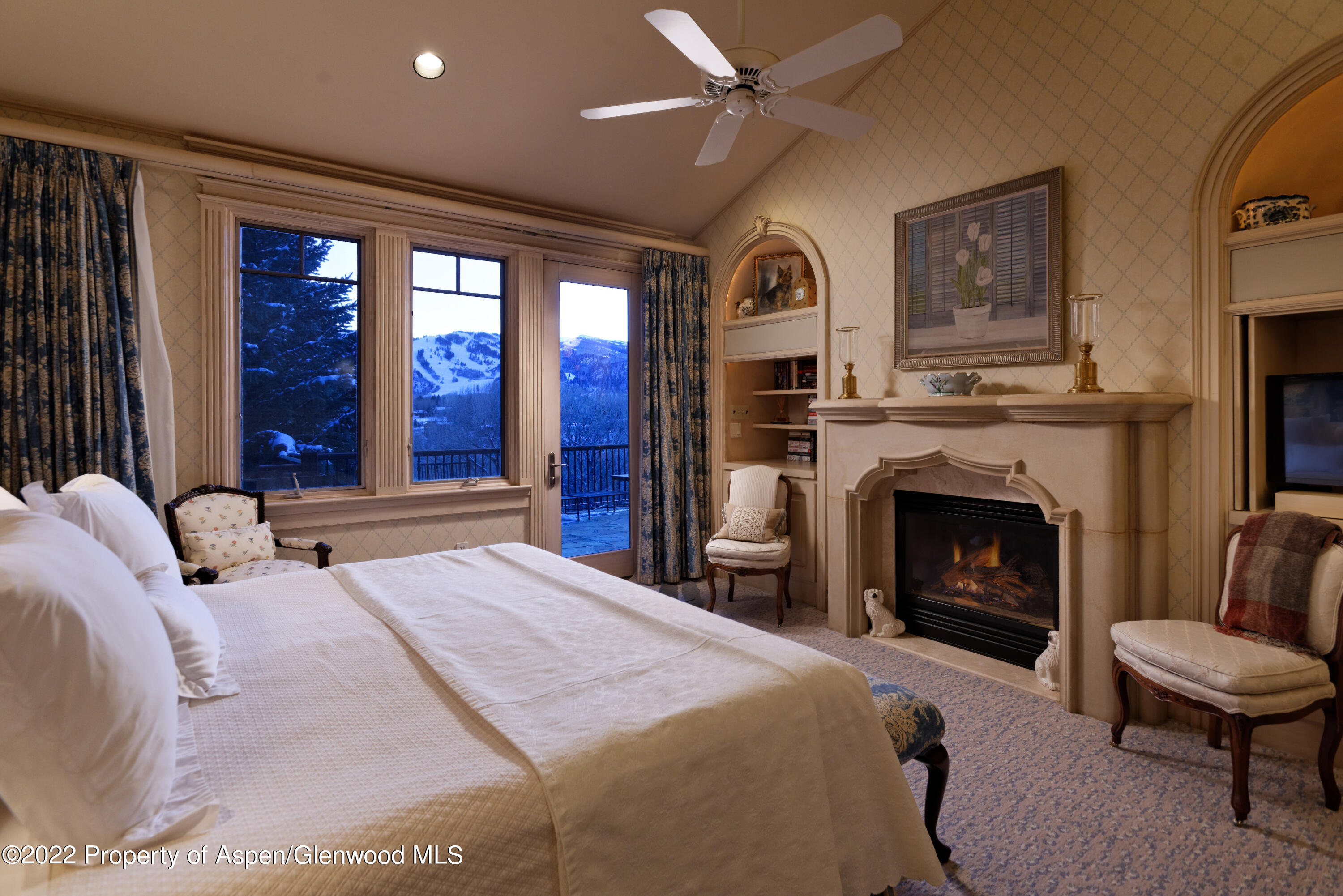 926 Willoughby Way Aspen, CO 81612 - Photo 16 of 47 a bedroom with a bed and a fireplace