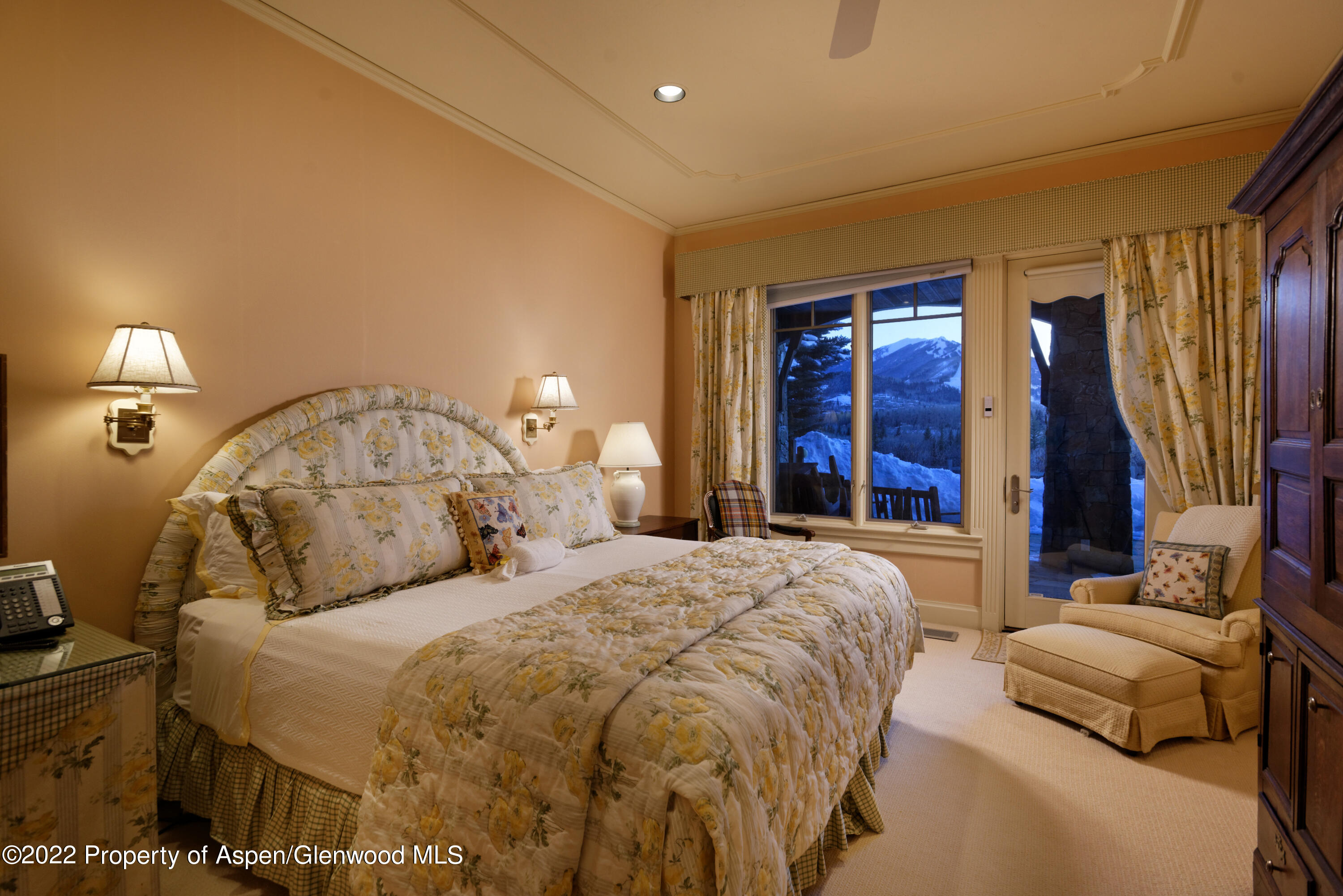 926 Willoughby Way Aspen, CO 81612 - Photo 22 of 47 a bedroom with a bed and a mirror