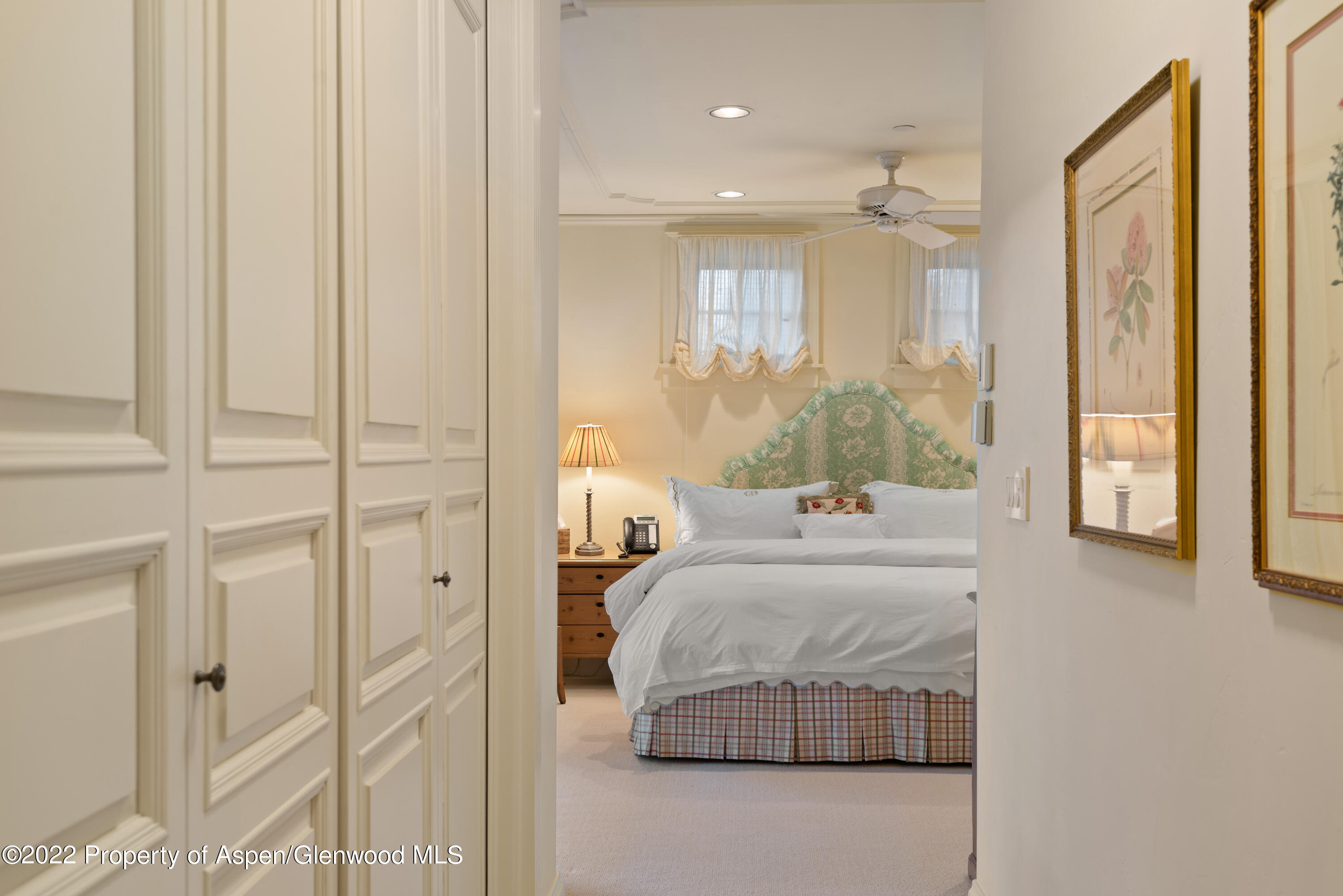 926 Willoughby Way Aspen, CO 81612 - Photo 24 of 47 a bedroom with a bed and a mirror