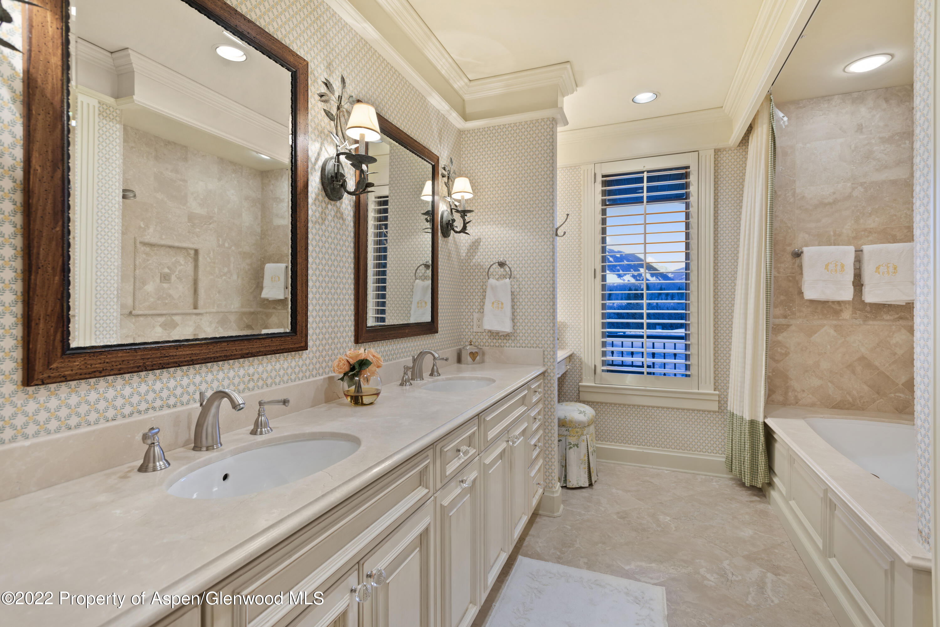 926 Willoughby Way Aspen, CO 81612 - Photo 30 of 47 a bathroom with a double vanity sink mirror and a bathtub