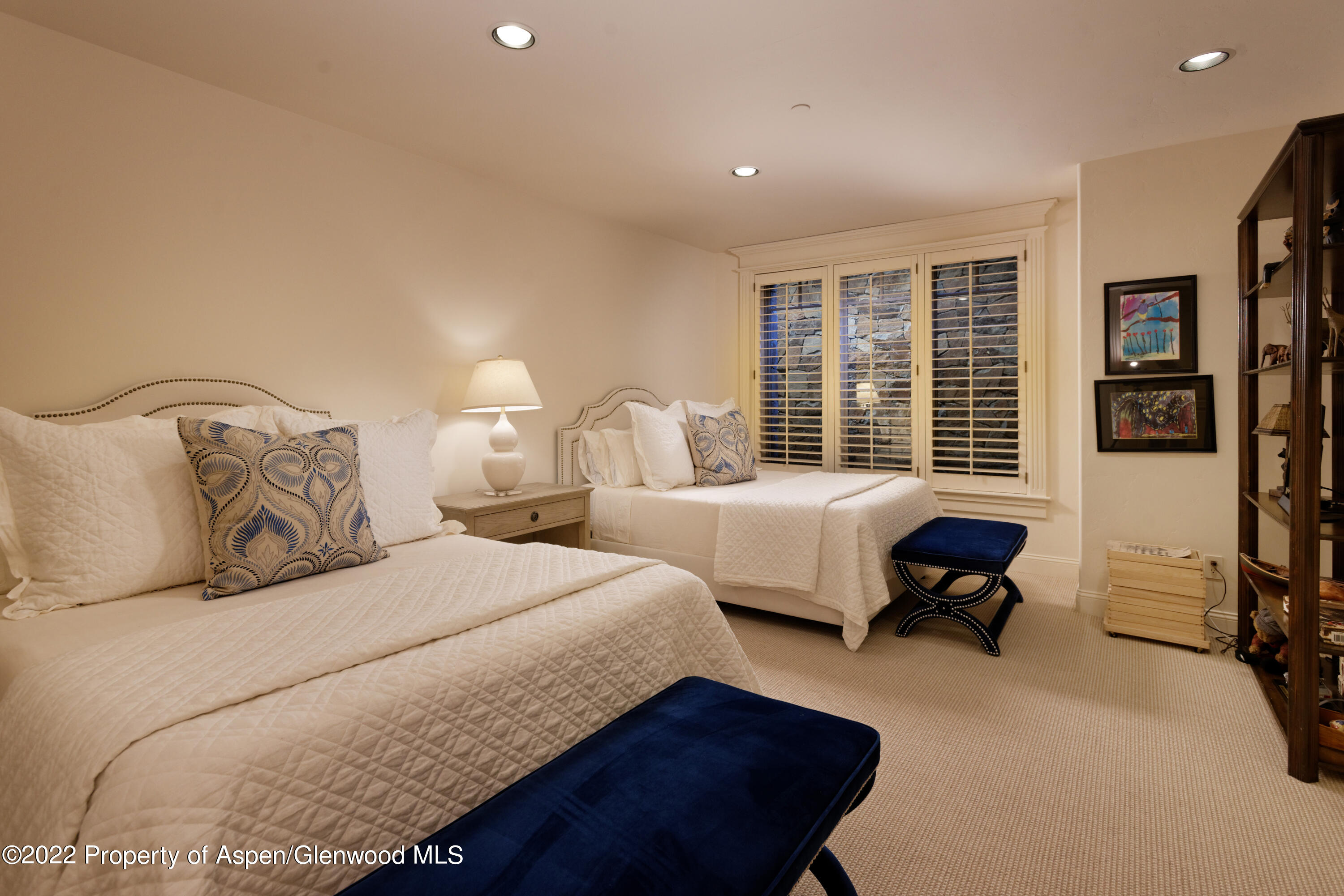 926 Willoughby Way Aspen, CO 81612 - Photo 35 of 47 a spacious bedroom with two beds and a couch