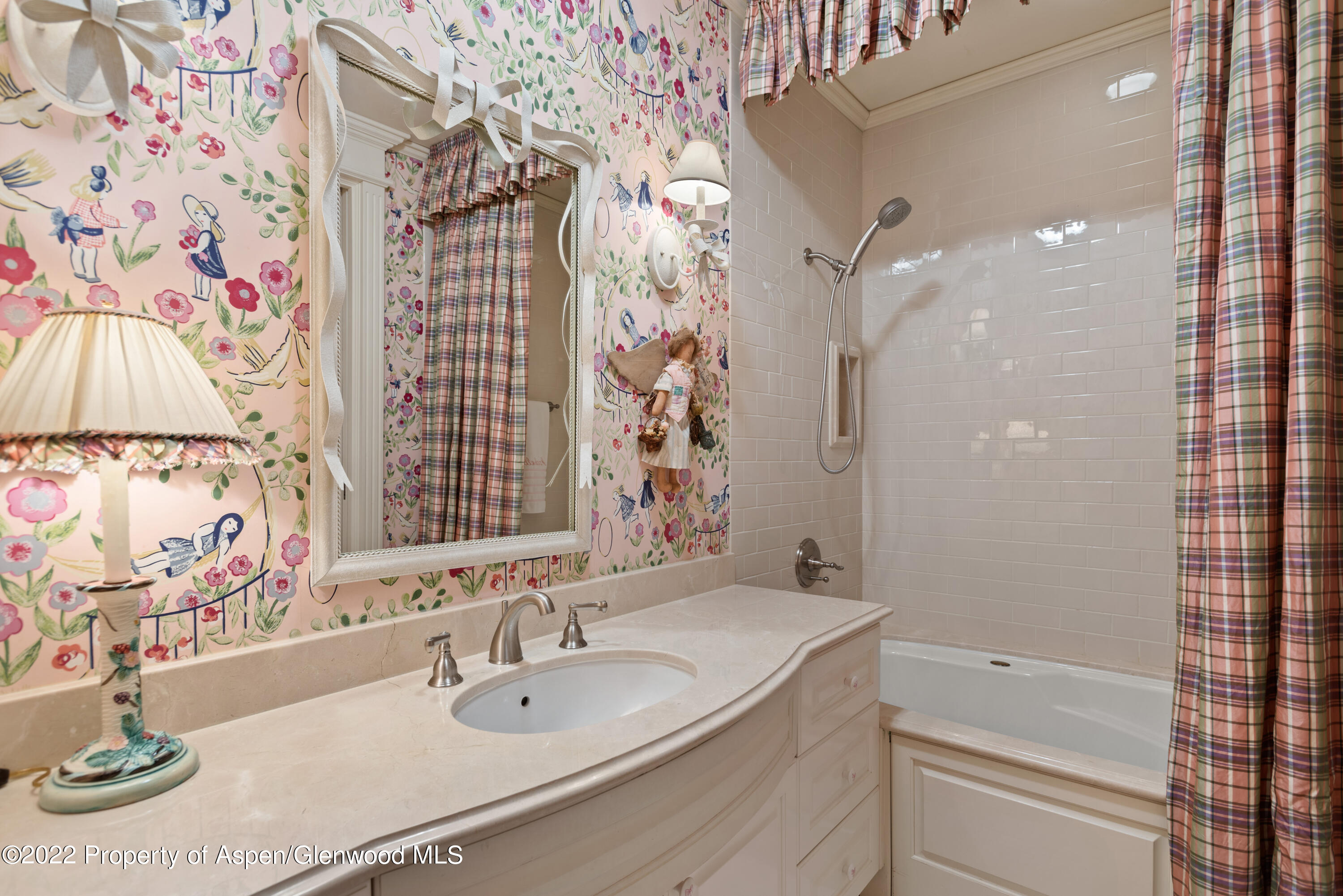 926 Willoughby Way Aspen, CO 81612 - Photo 36 of 47 a bathroom with a granite countertop sink a toilet and shower