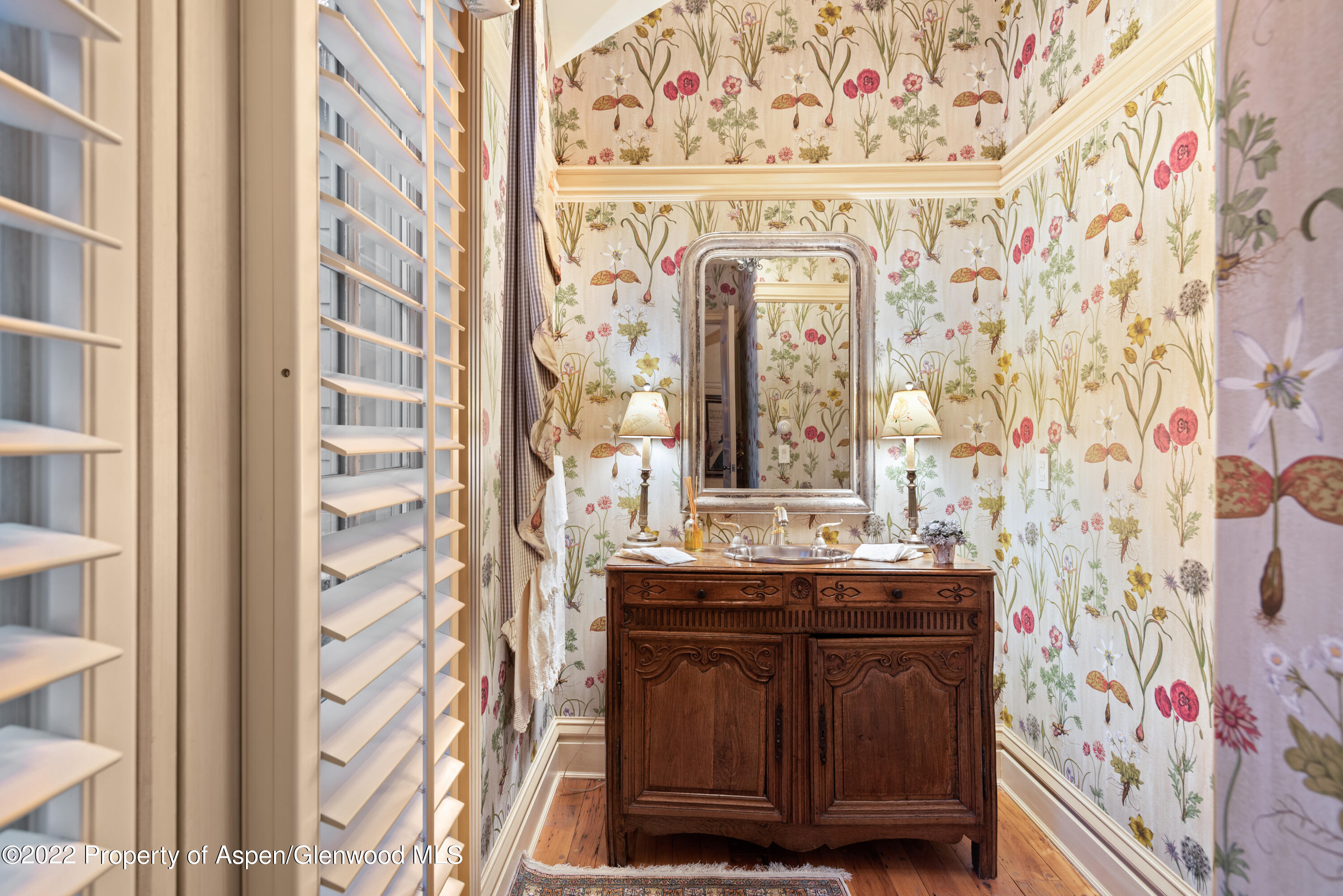 926 Willoughby Way Aspen, CO 81612 - Photo 39 of 47 a bathroom with a granite countertop sink and a mirror