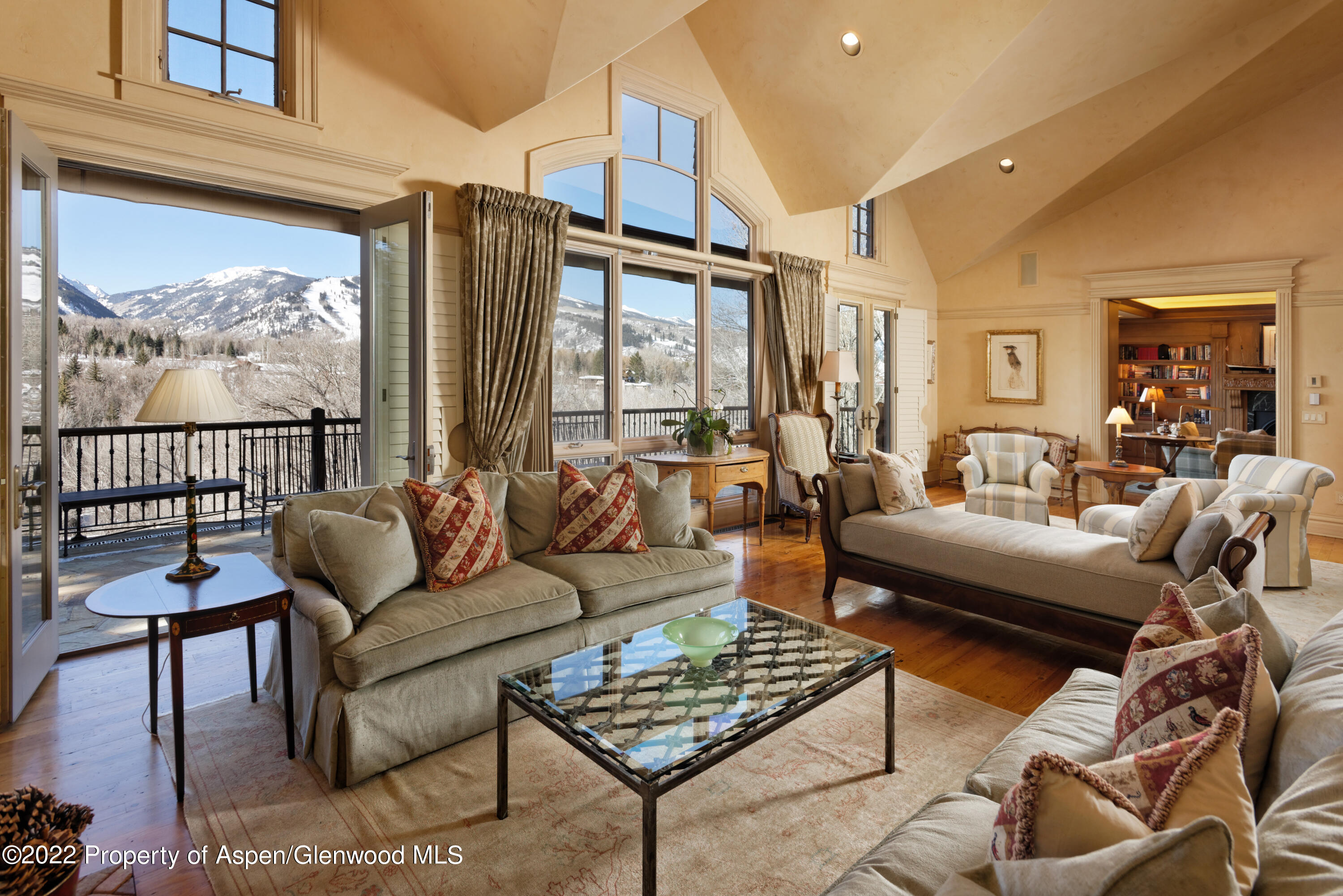 926 Willoughby Way Aspen, CO 81612 - Photo 4 of 47 a living room with furniture a rug and a large window