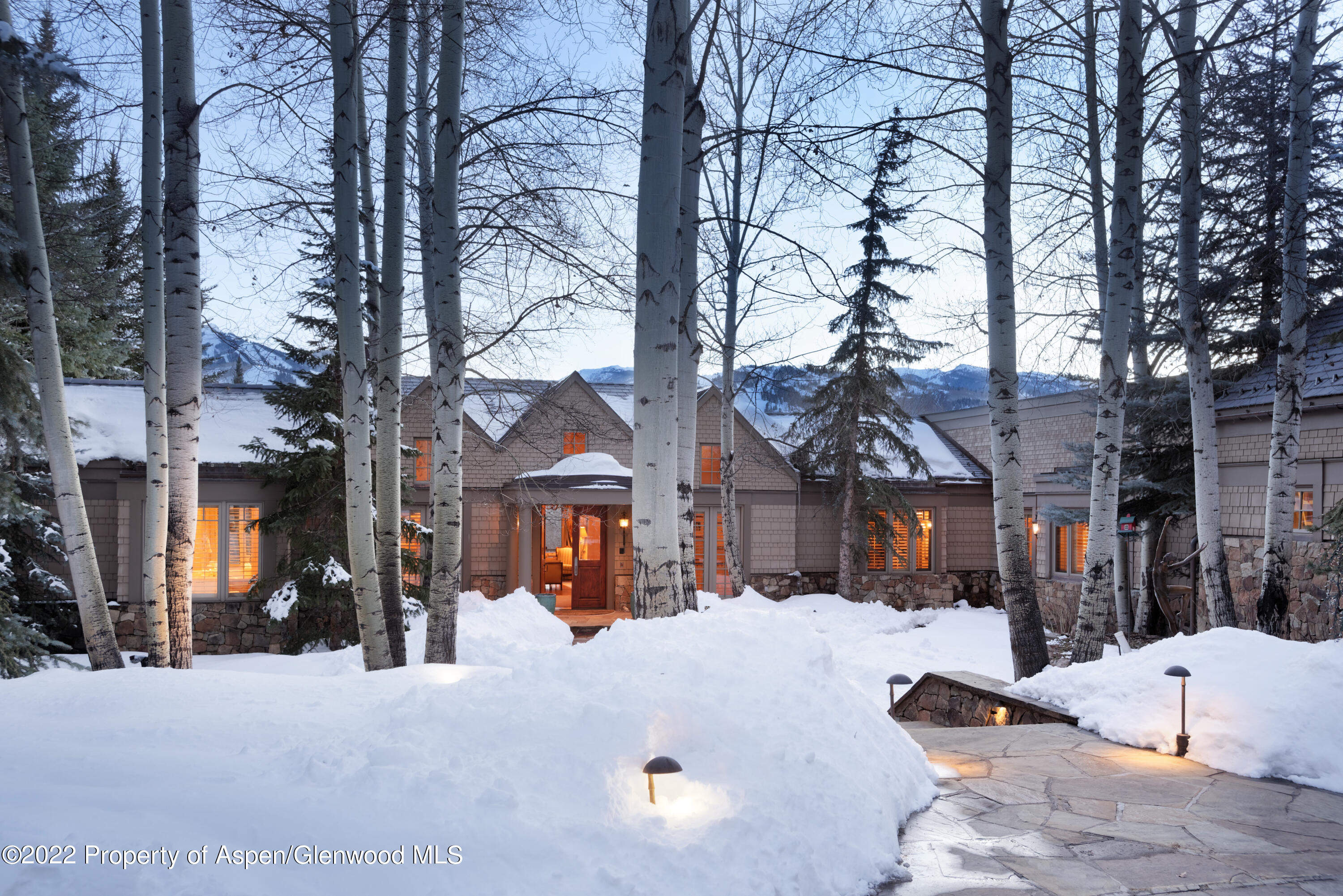 926 Willoughby Way Aspen, CO 81612 - Photo 42 of 47 a view of the house with a snow in a yard