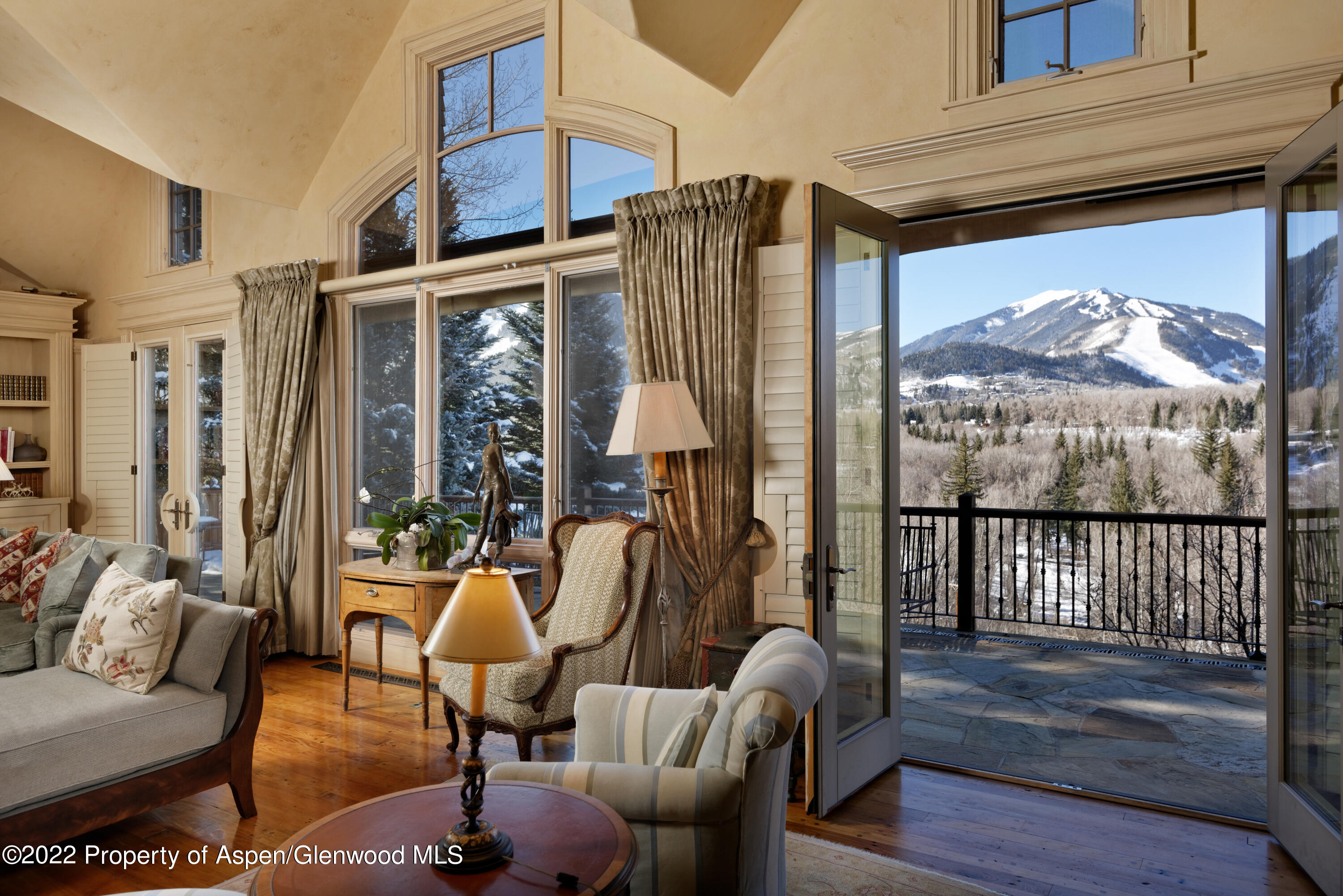 926 Willoughby Way Aspen, CO 81612 - Photo 5 of 47 a living room with furniture windows and wooden floor
