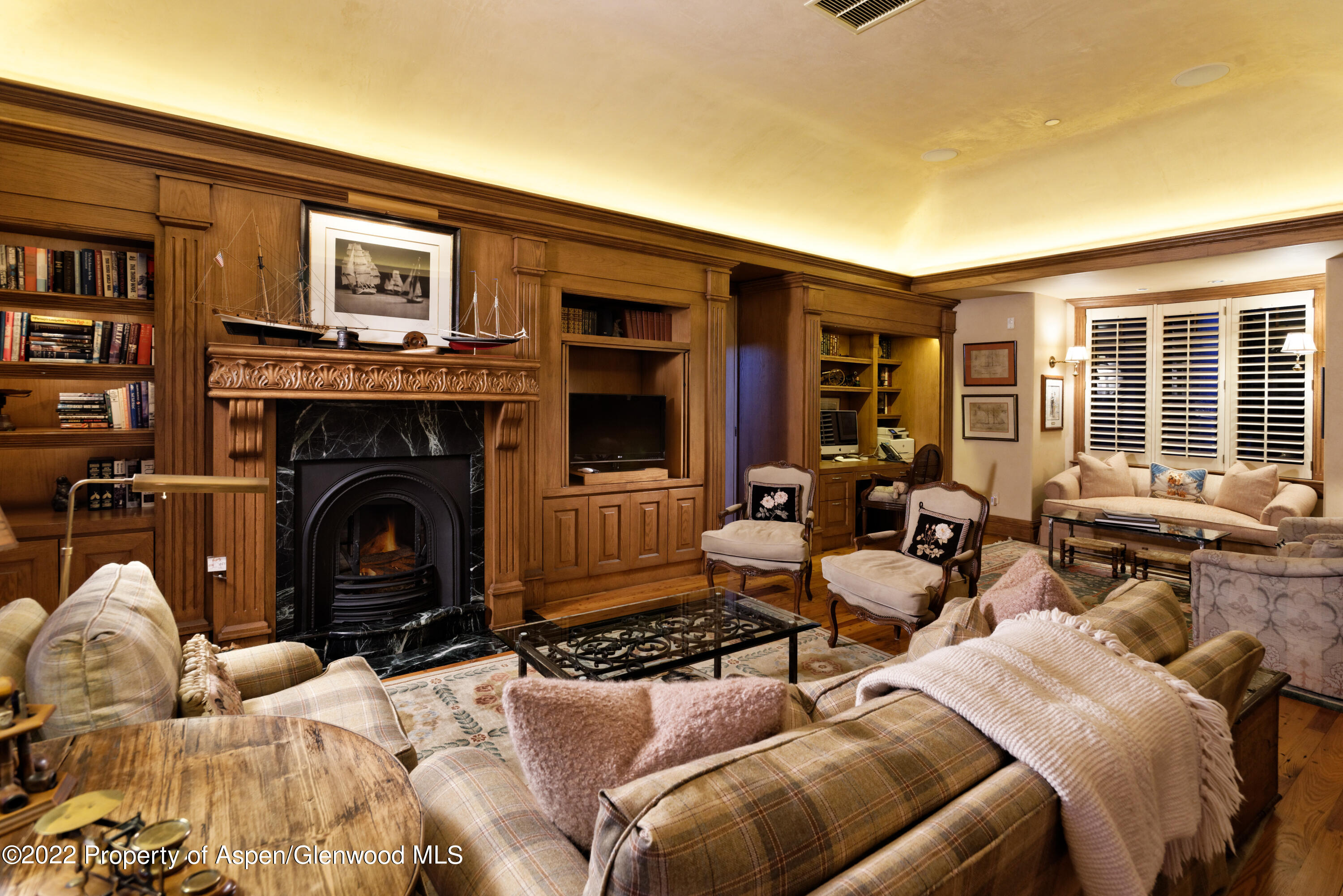 926 Willoughby Way Aspen, CO 81612 - Photo 10 of 47 a living room with furniture windows and a fireplace