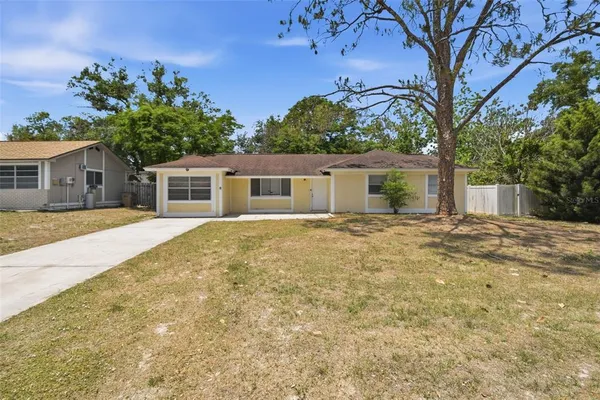 front view of a house with a yard