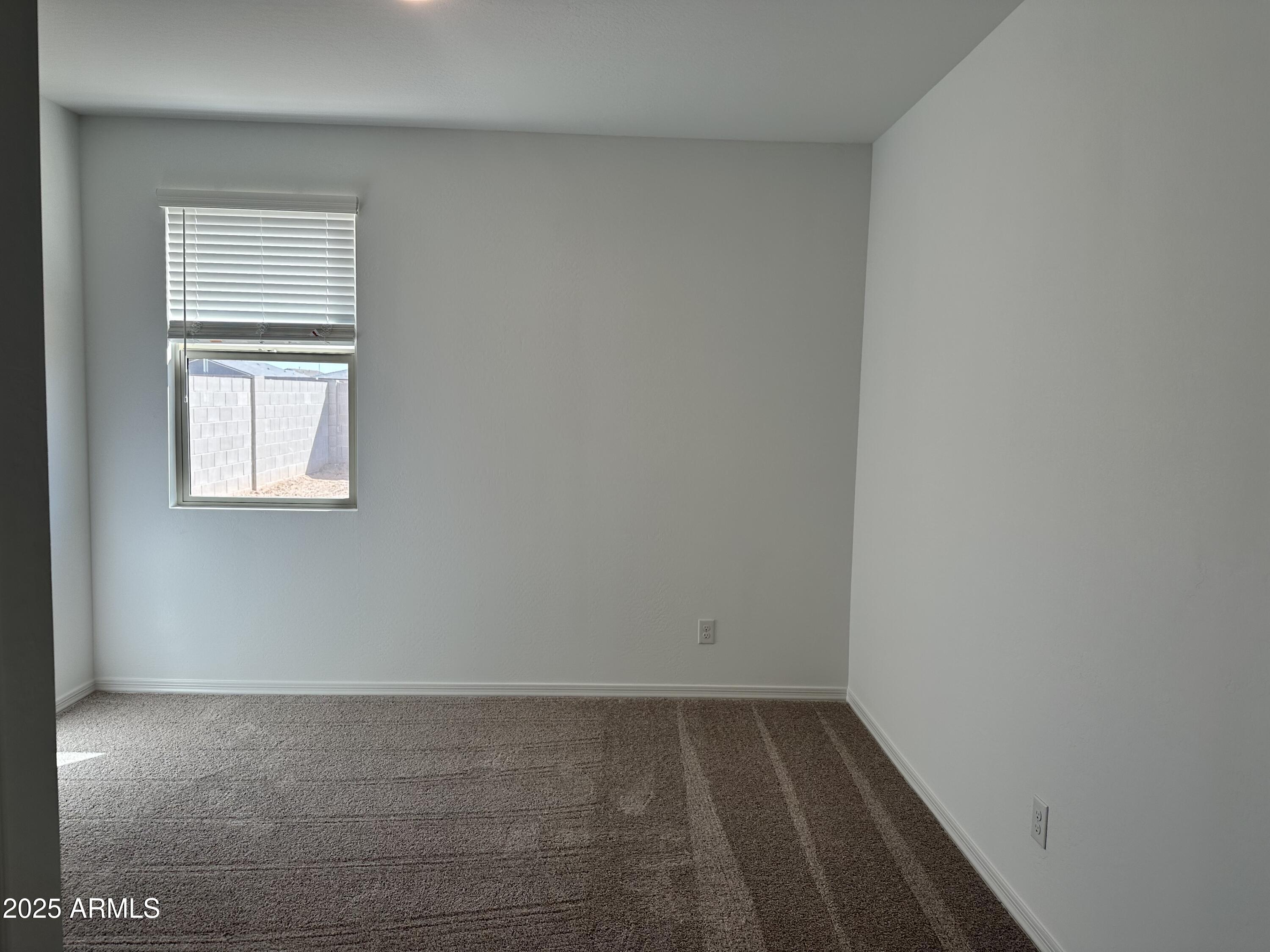 5535 West Hopi Trail Laveen, AZ 85339 - Photo 16 of 45 a view of a room that has a window in it