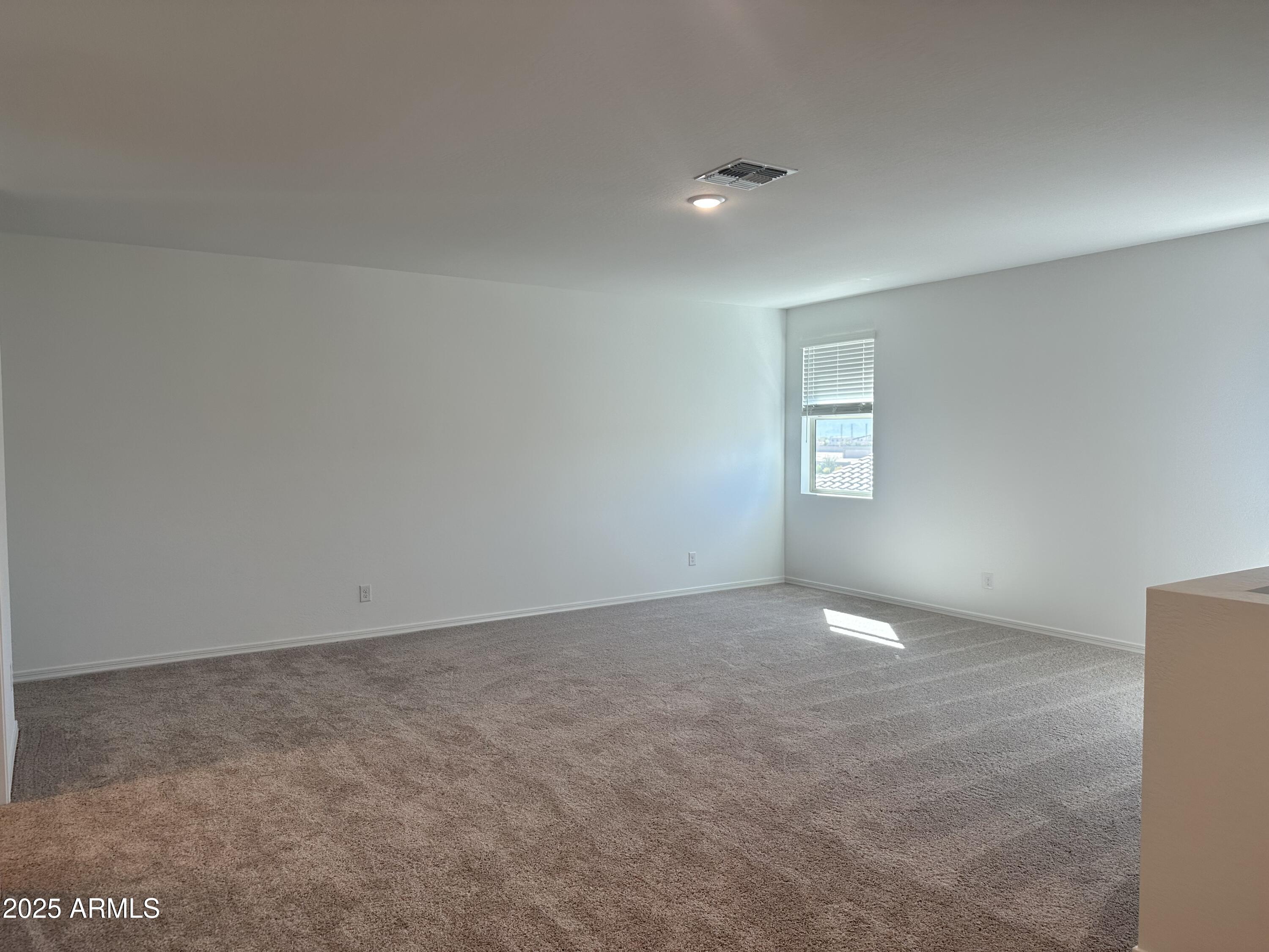5535 West Hopi Trail Laveen, AZ 85339 - Photo 19 of 45 an empty room with windows