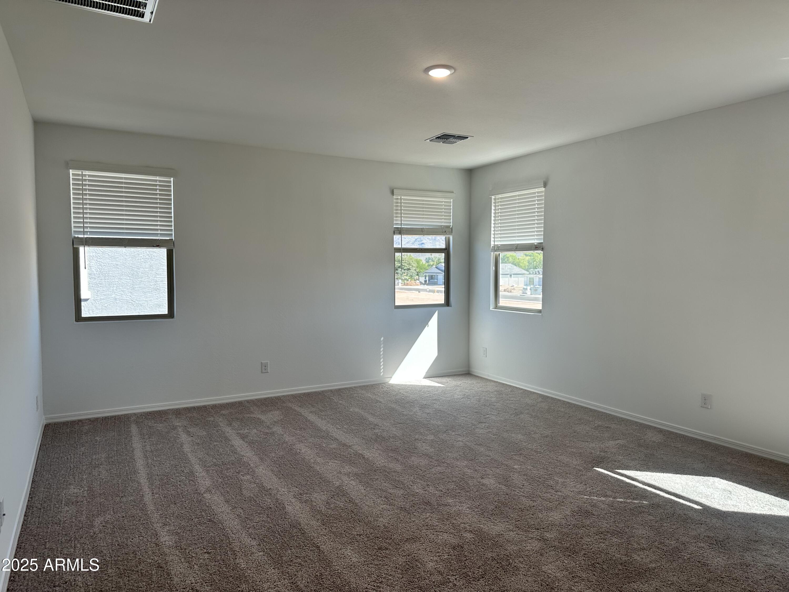 5535 West Hopi Trail Laveen, AZ 85339 - Photo 24 of 45 an empty room with windows