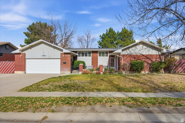 1583 Meadowmoor Road Holladay, UT 84117 - Photo 1 of 1 Ranch-style house featuring brick siding, concrete driveway, and a garage