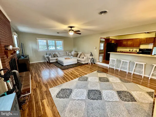 a bedroom with furniture and a flat screen tv