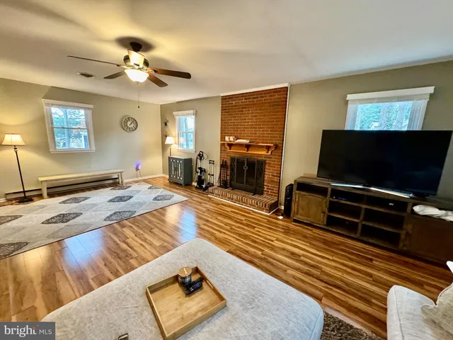 a kitchen with stainless steel appliances granite countertop a sink and wooden cabinets