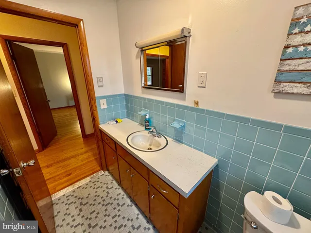 a view of an empty room and wooden floor