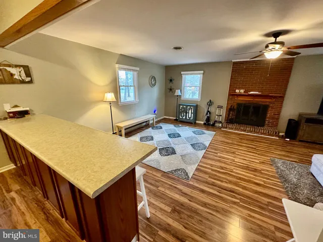a living room with furniture and a rug
