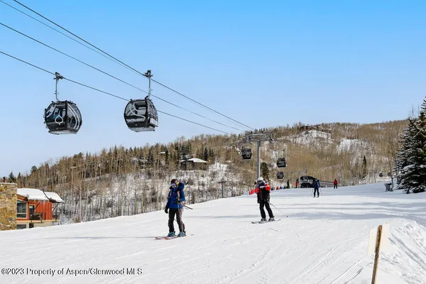 a group of people riding bikes down a street