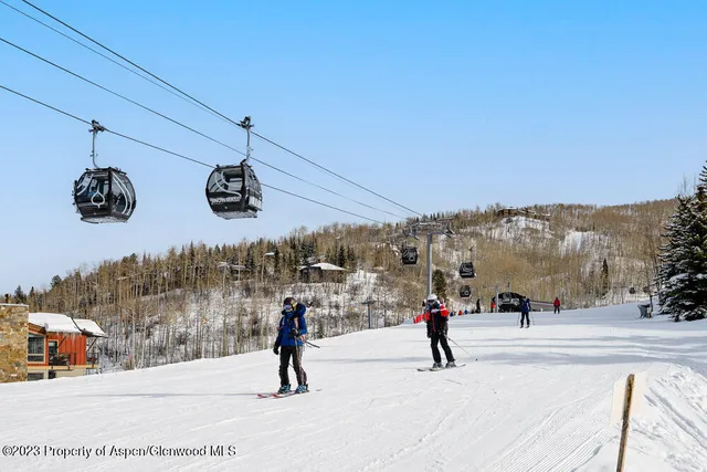 a group of people riding bikes down a street