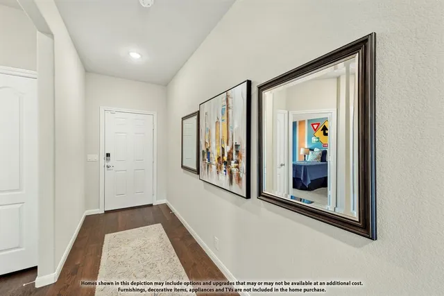 a view of a hallway with wooden floor and windows