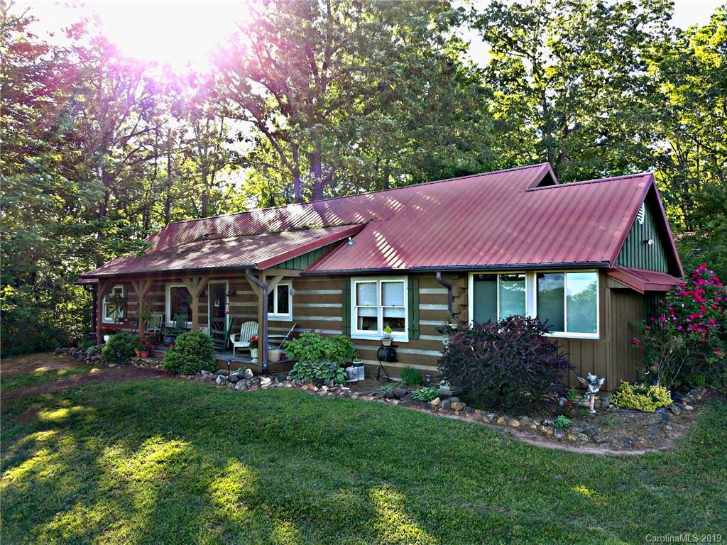 5911 Big Level Road Mill Spring, NC 28756 - Photo 4 of 47 a view of a house with a garden