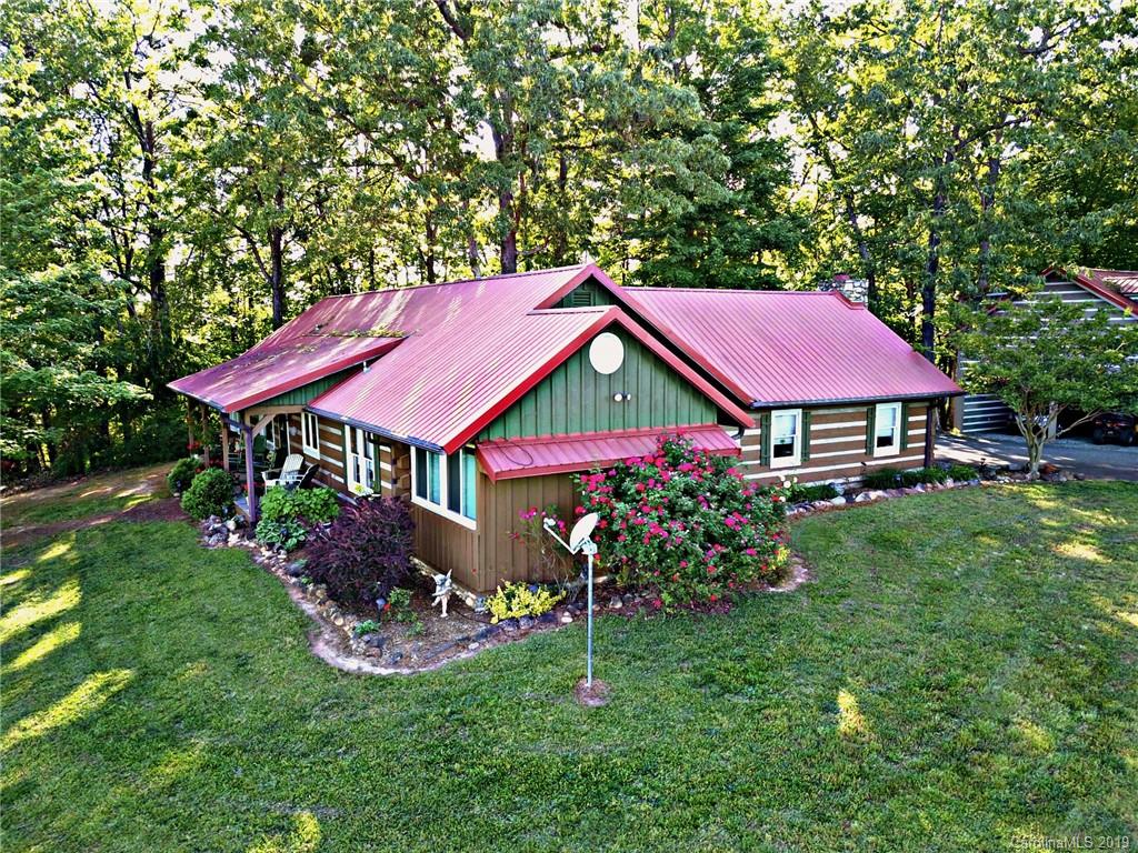5911 Big Level Road Mill Spring, NC 28756 - Photo 5 of 47 a view of a house with garden