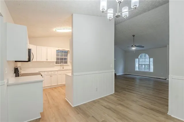 a view of a kitchen from the hallway