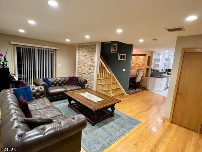 245 Lanza Avenue, Unit 1 Garfield, NJ 07026 - Photo 1 of 30 a living room with furniture and a flat screen tv