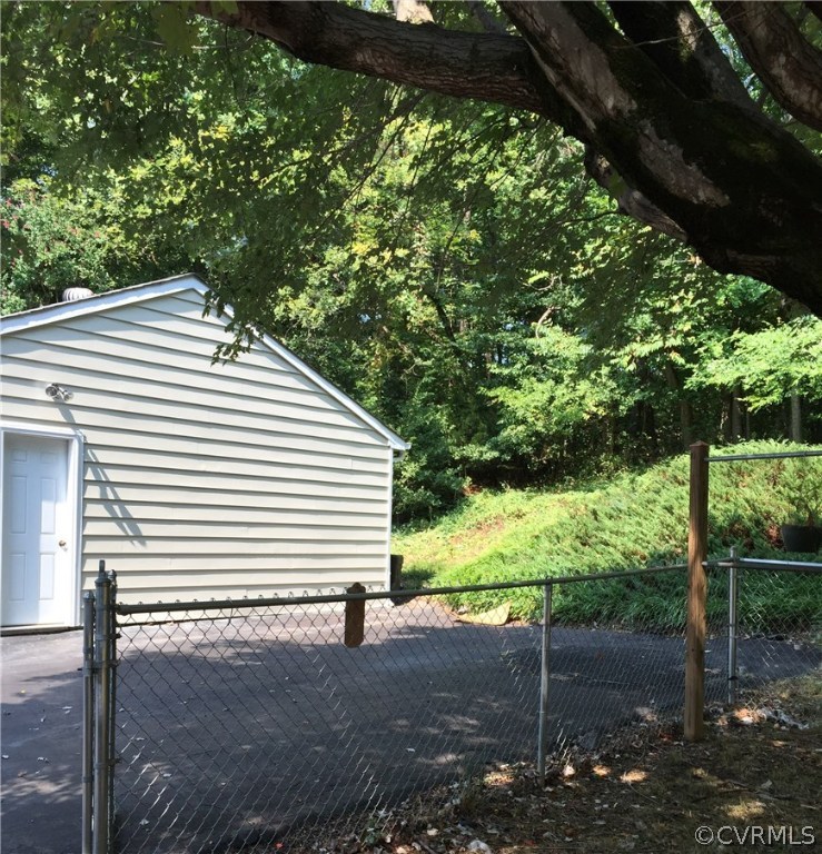 7820 Conifer Road North Chesterfield, VA 23237 - Photo 23 of 24 Side entrance to garage and more parking area.