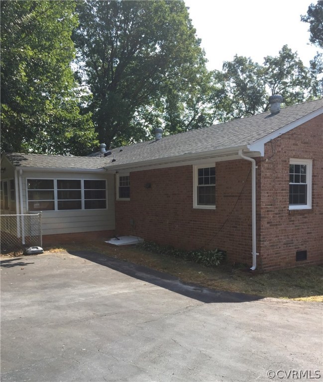 Back of home - note nice new roof and the Florida