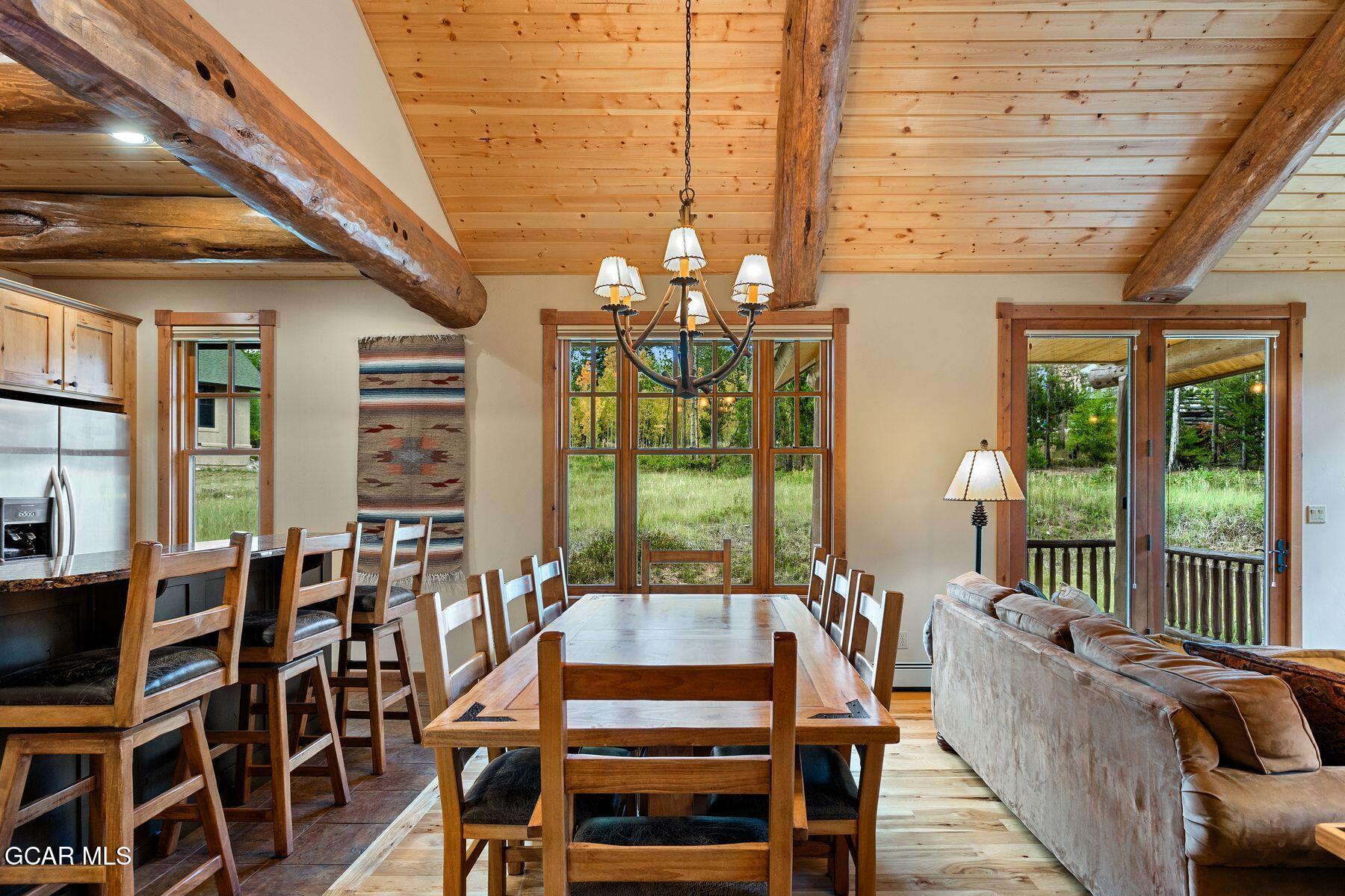445 Trappers Way Fraser, CO 80442 - Photo 11 of 37 a living room with furniture and a floor to ceiling window