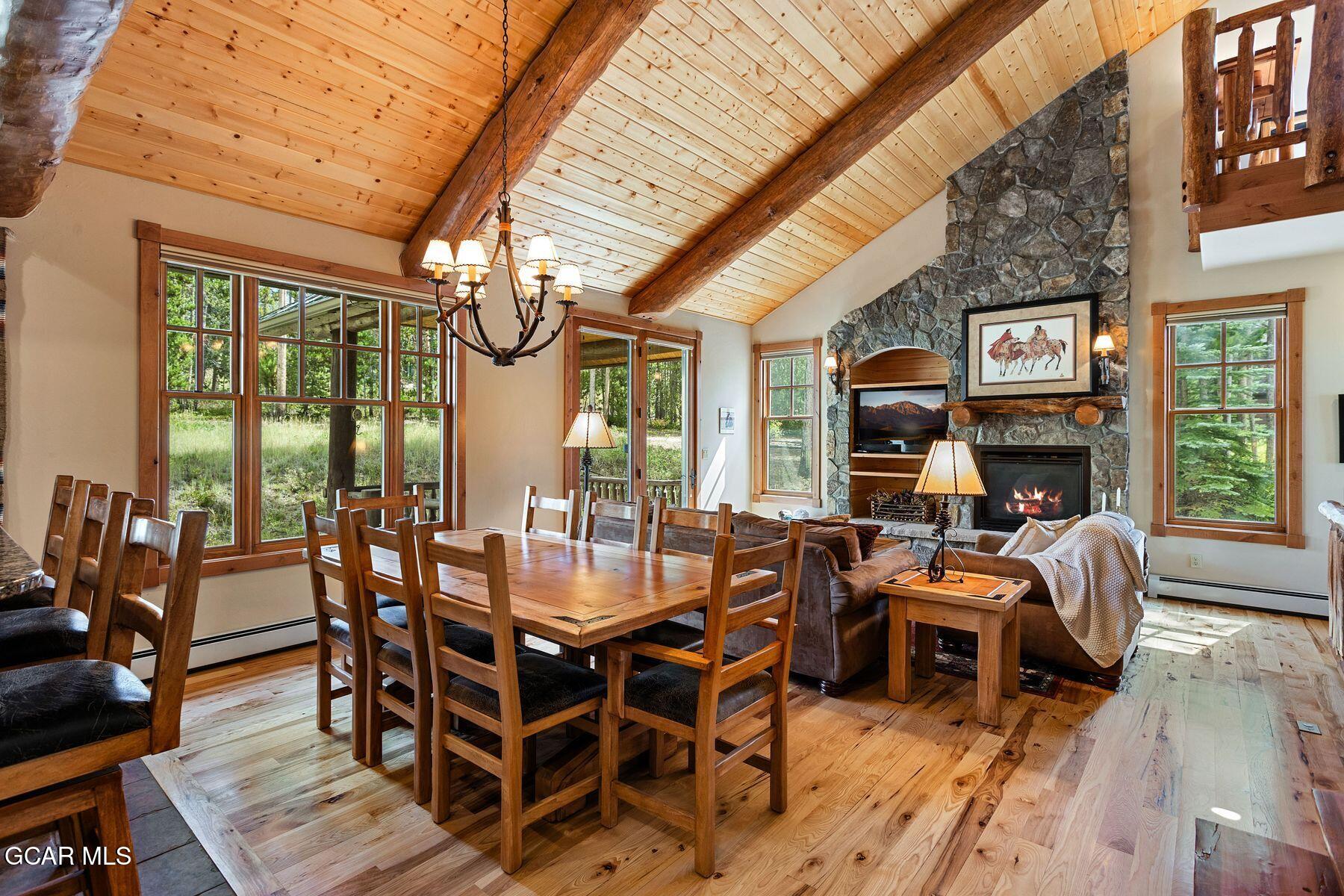 445 Trappers Way Fraser, CO 80442 - Photo 12 of 37 a view of a dining room with furniture window and wooden floor