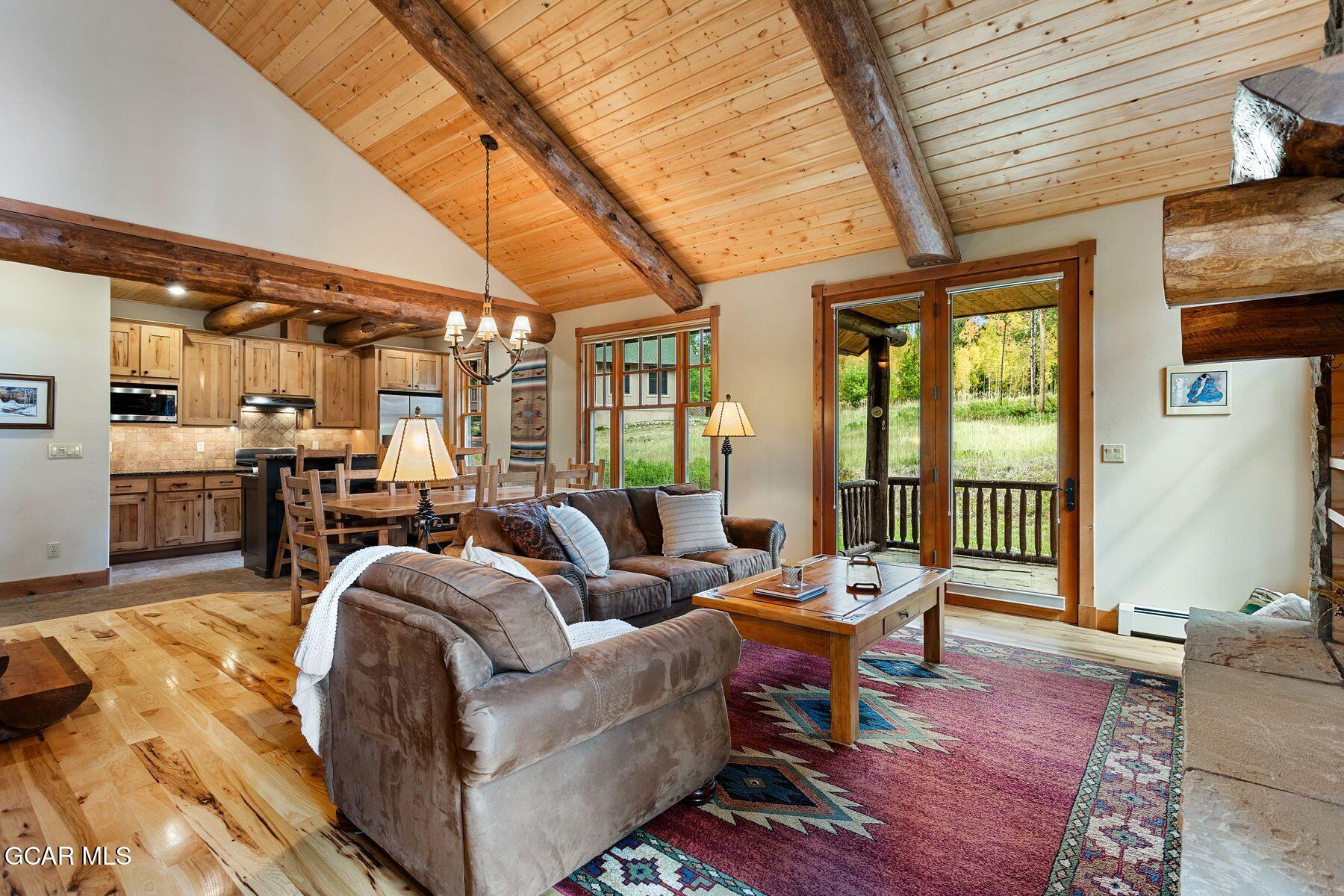 445 Trappers Way Fraser, CO 80442 - Photo 13 of 37 a living room with furniture and a large window