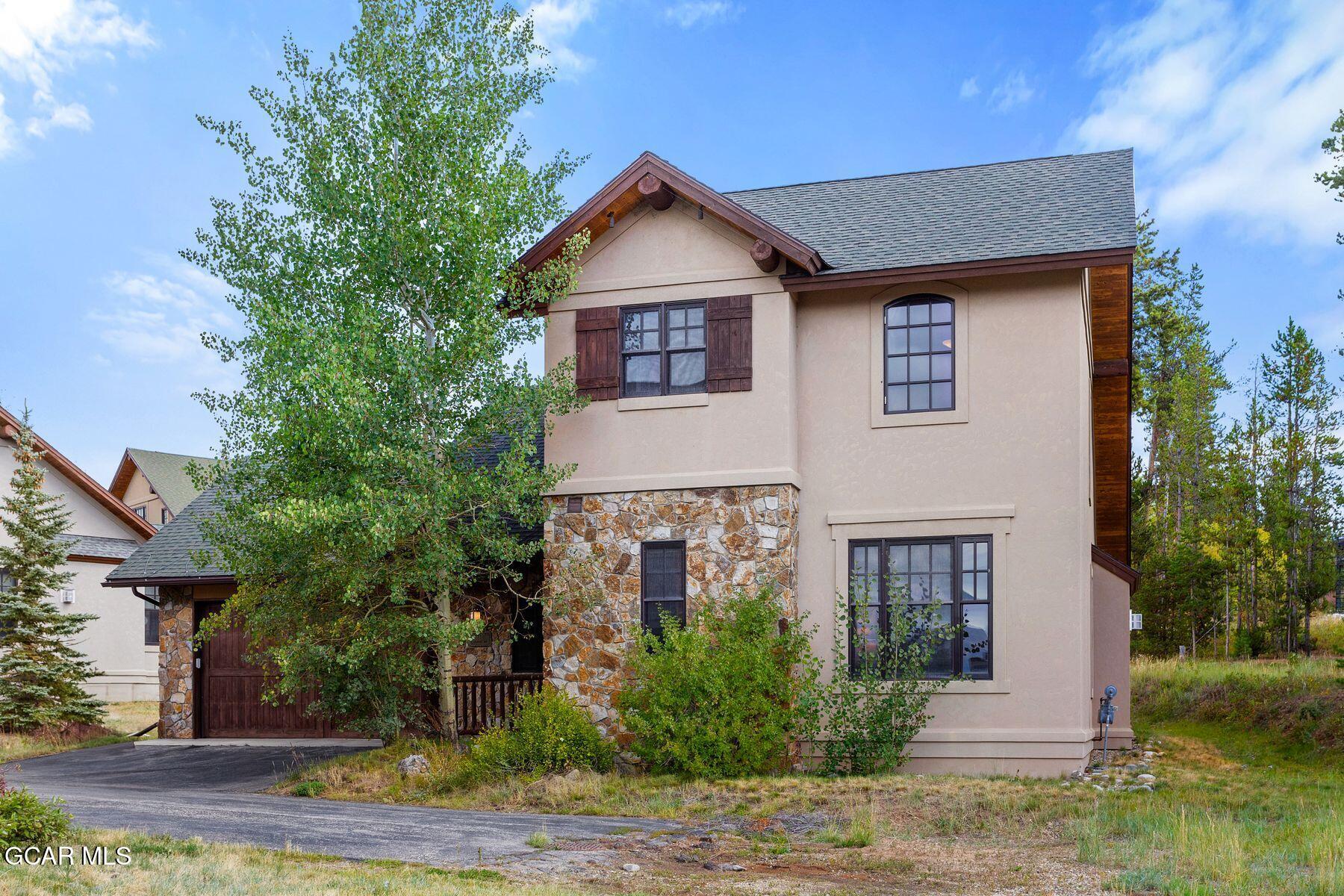 445 Trappers Way Fraser, CO 80442 - Photo 2 of 37 a view of a yard in front of a house