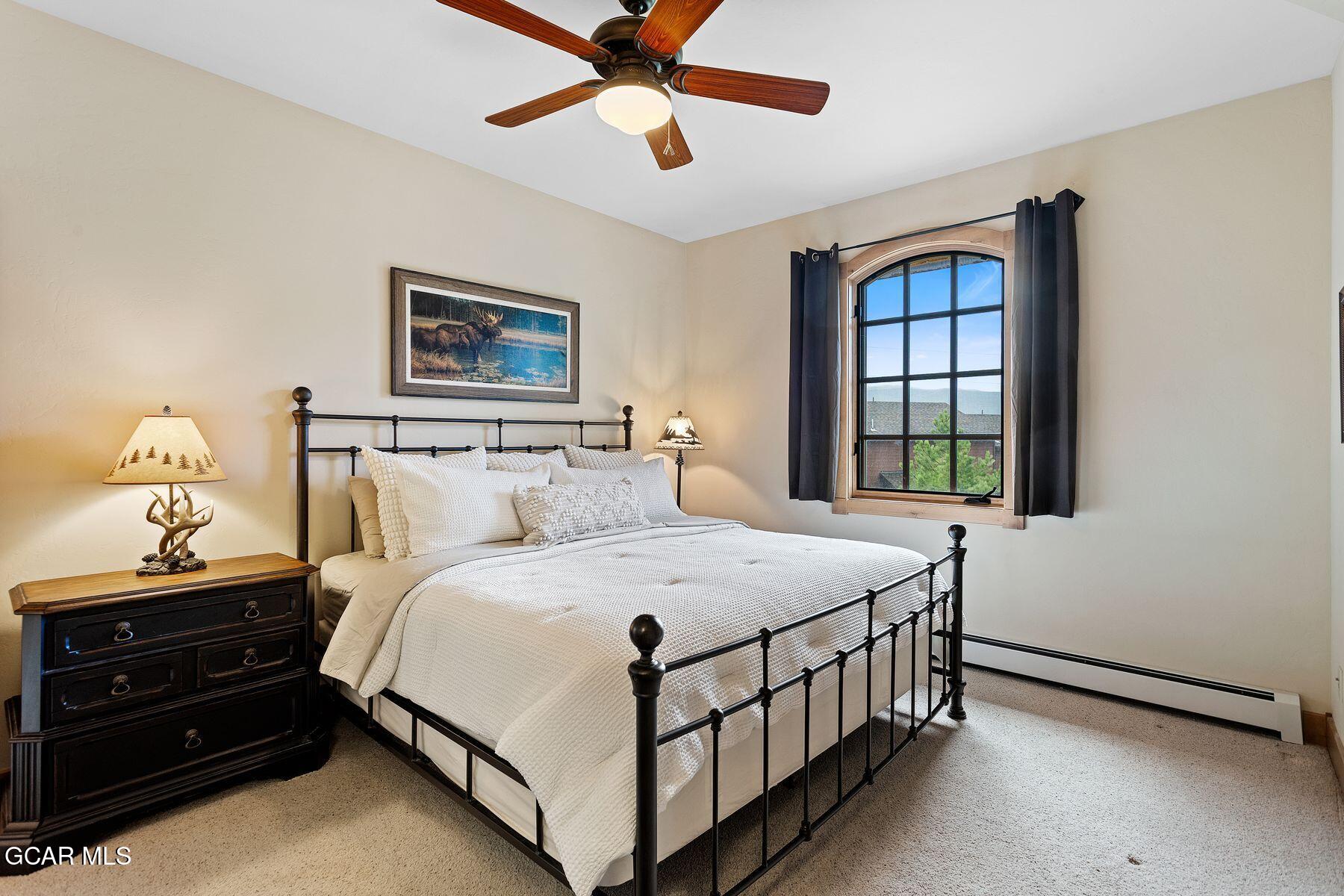 445 Trappers Way Fraser, CO 80442 - Photo 22 of 37 a bedroom with a bed and a window