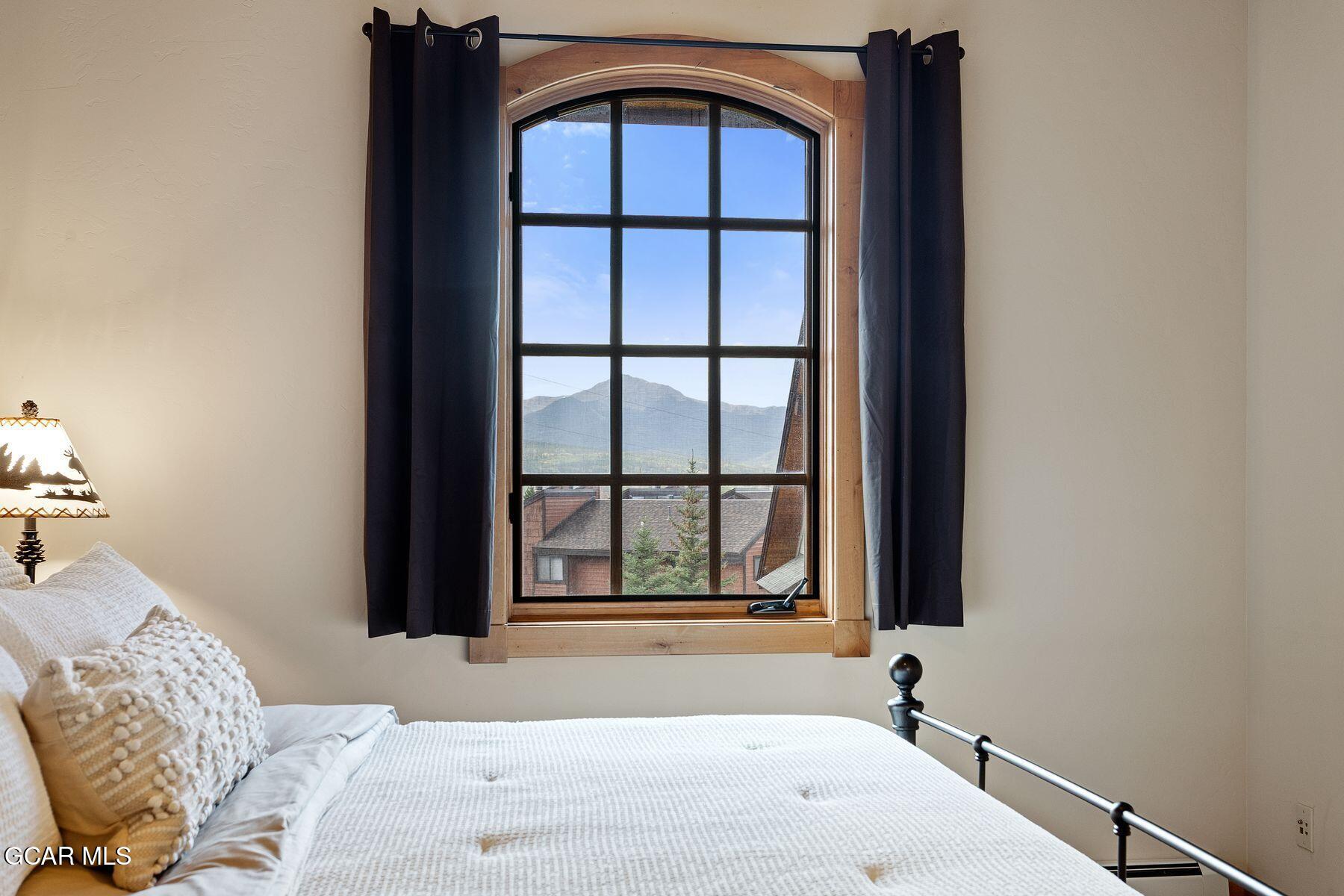 445 Trappers Way Fraser, CO 80442 - Photo 23 of 37 a bathroom with a bathtub and window