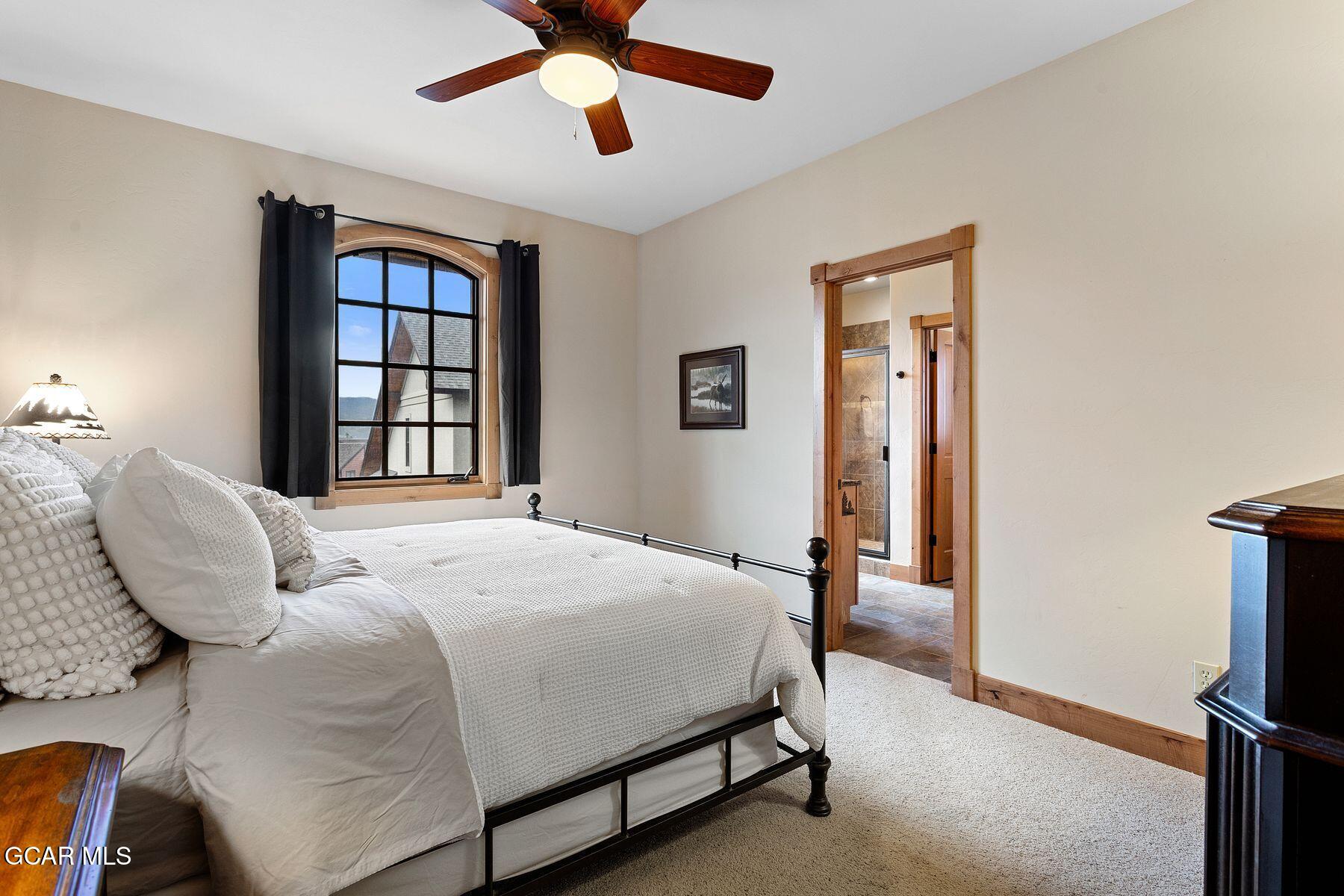 445 Trappers Way Fraser, CO 80442 - Photo 24 of 37 a bedroom with a bed and a window