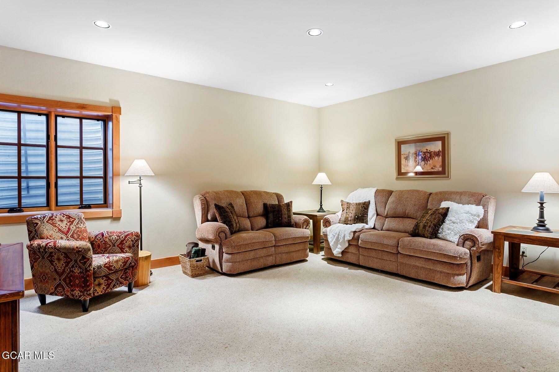 445 Trappers Way Fraser, CO 80442 - Photo 28 of 37 a living room with furniture and a large window