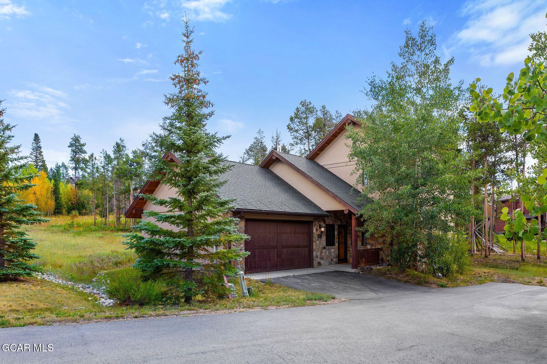 445 Trappers Way Fraser, CO 80442 - Photo 3 of 37 a view of a house and outdoor space