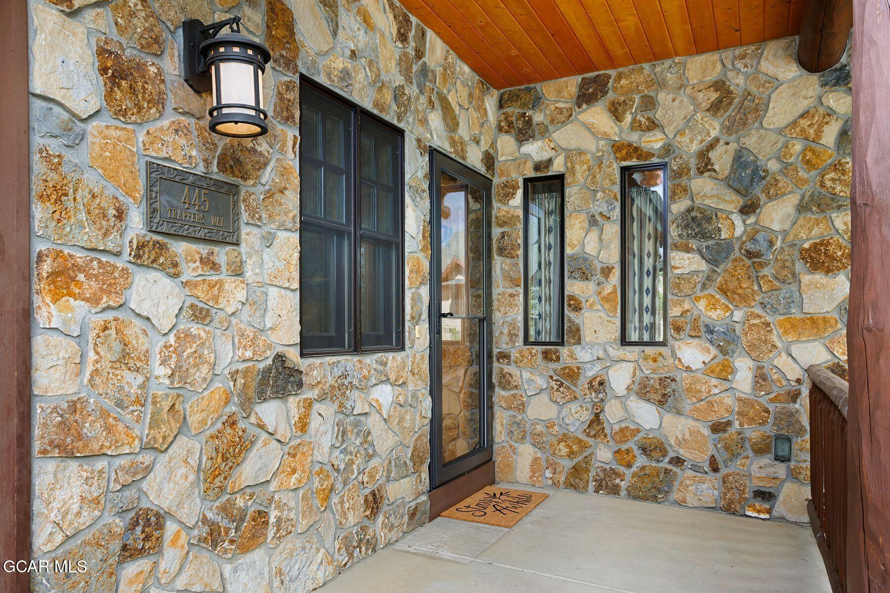 445 Trappers Way Fraser, CO 80442 - Photo 4 of 37 front view of a brick house