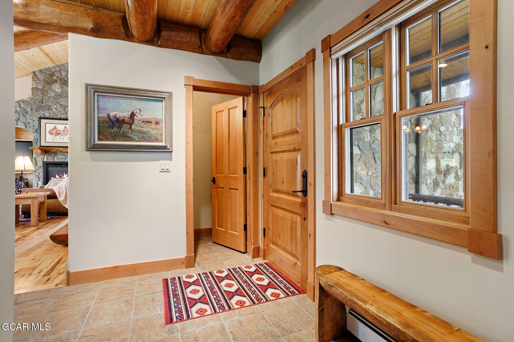 445 Trappers Way Fraser, CO 80442 - Photo 5 of 37 a view of an entryway with wooden floor