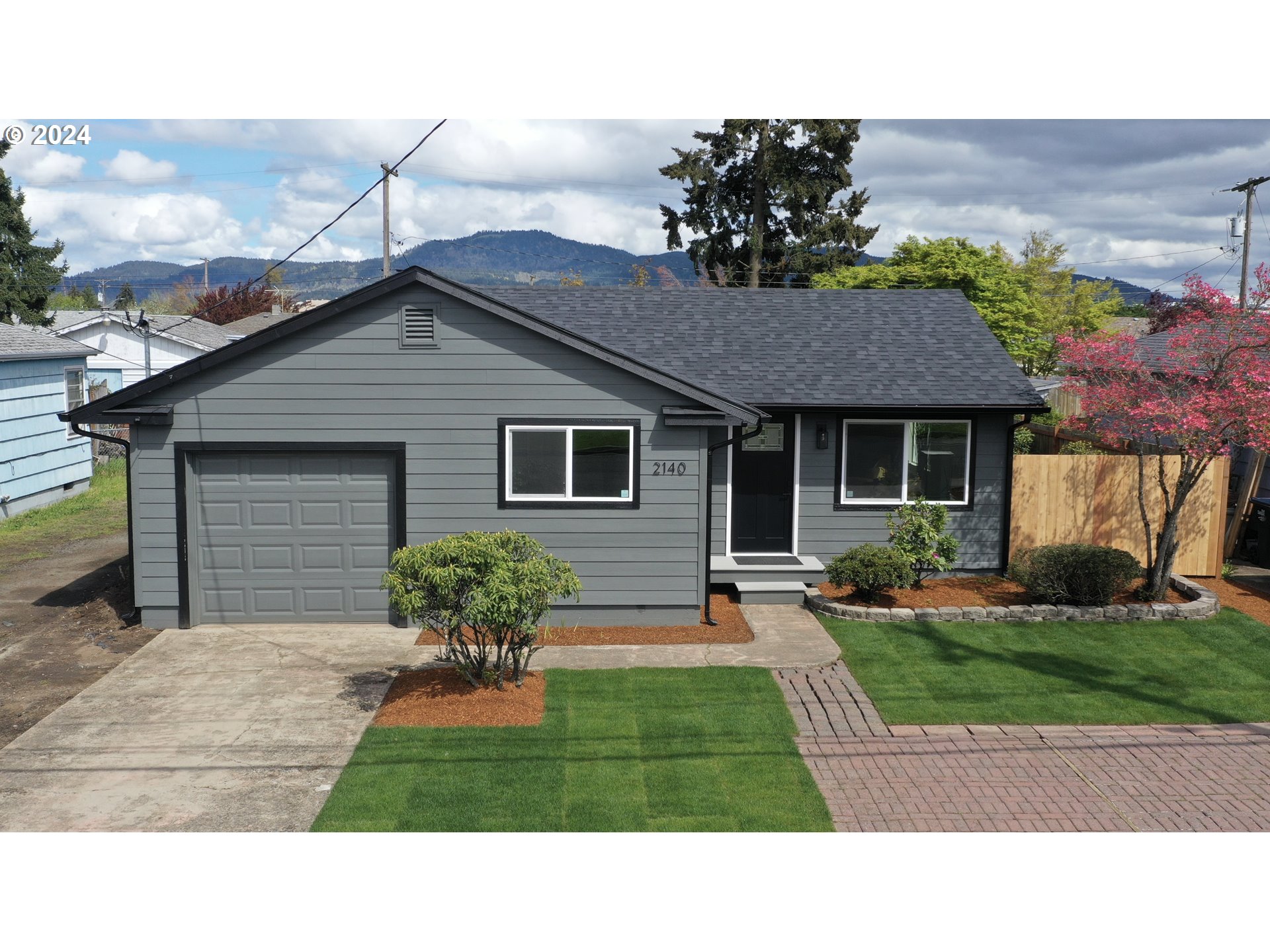2140 J Street Springfield, OR 97477 - Photo 1 of 23 a house view with a garden space