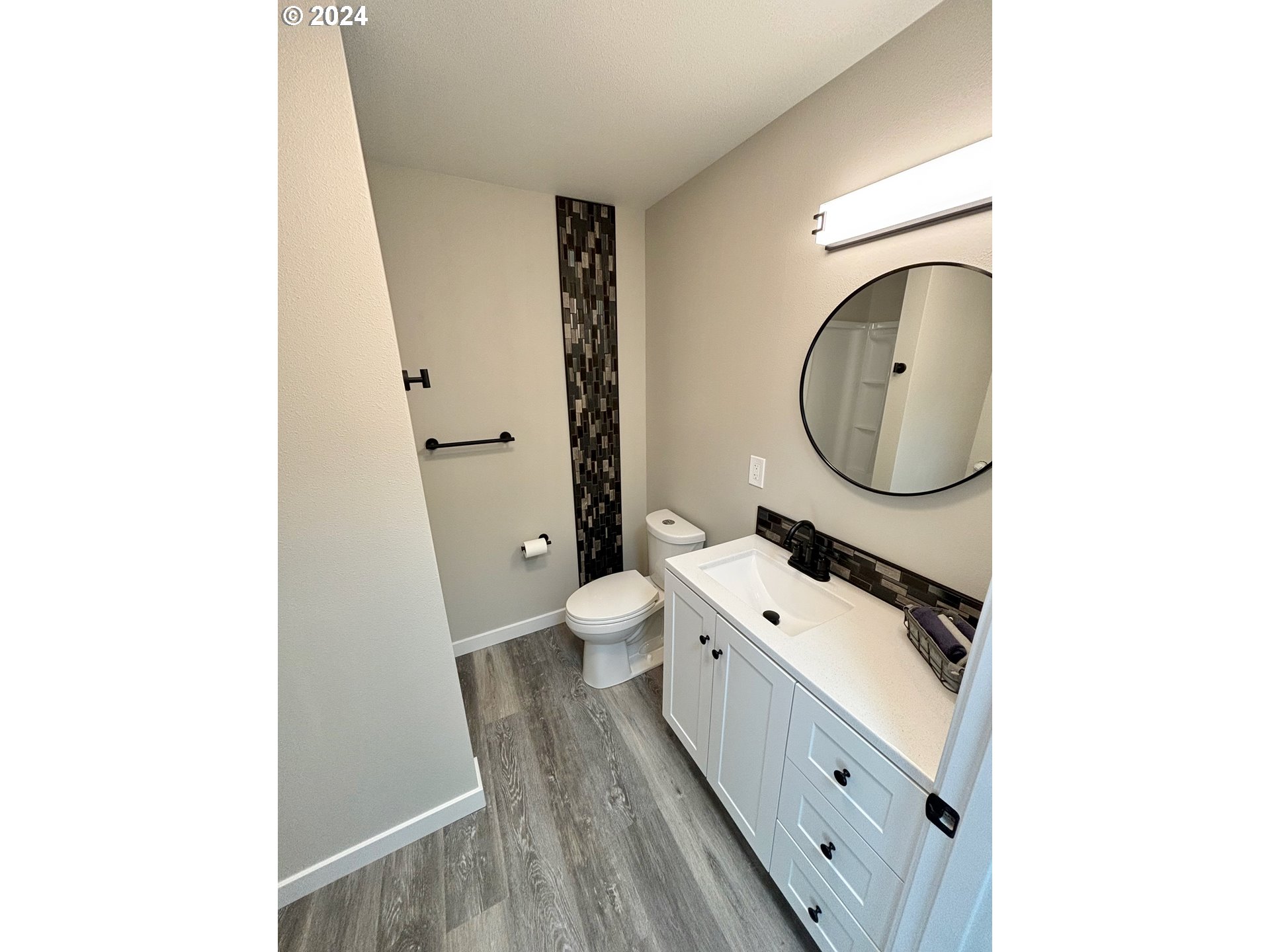 2140 J Street Springfield, OR 97477 - Photo 15 of 23 a bathroom with a sink a toilet and a mirror
