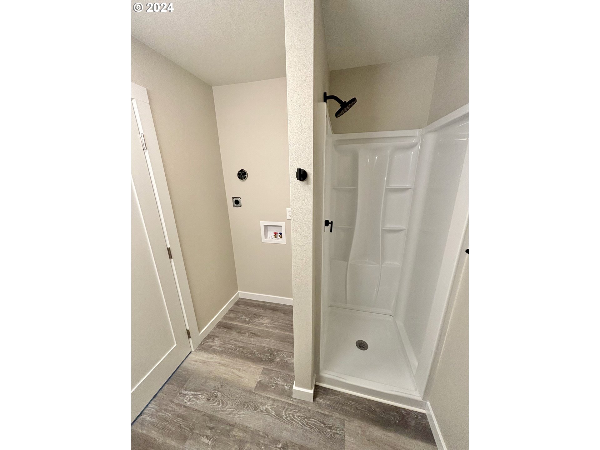 2140 J Street Springfield, OR 97477 - Photo 16 of 23 a bathroom with a glass shower door