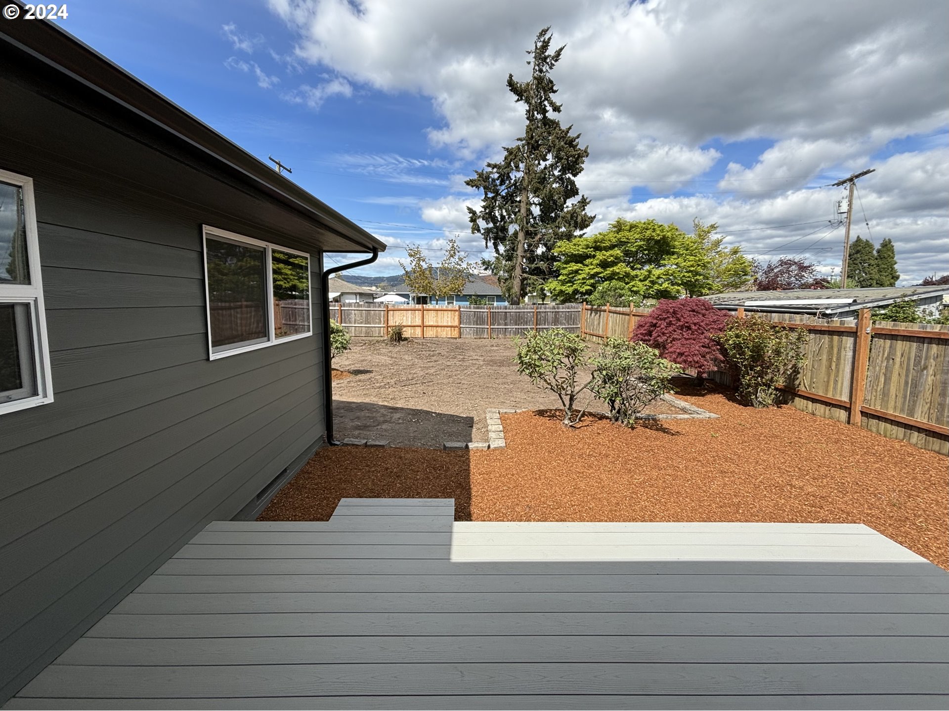 2140 J Street Springfield, OR 97477 - Photo 22 of 23 a view of a backyard of the house