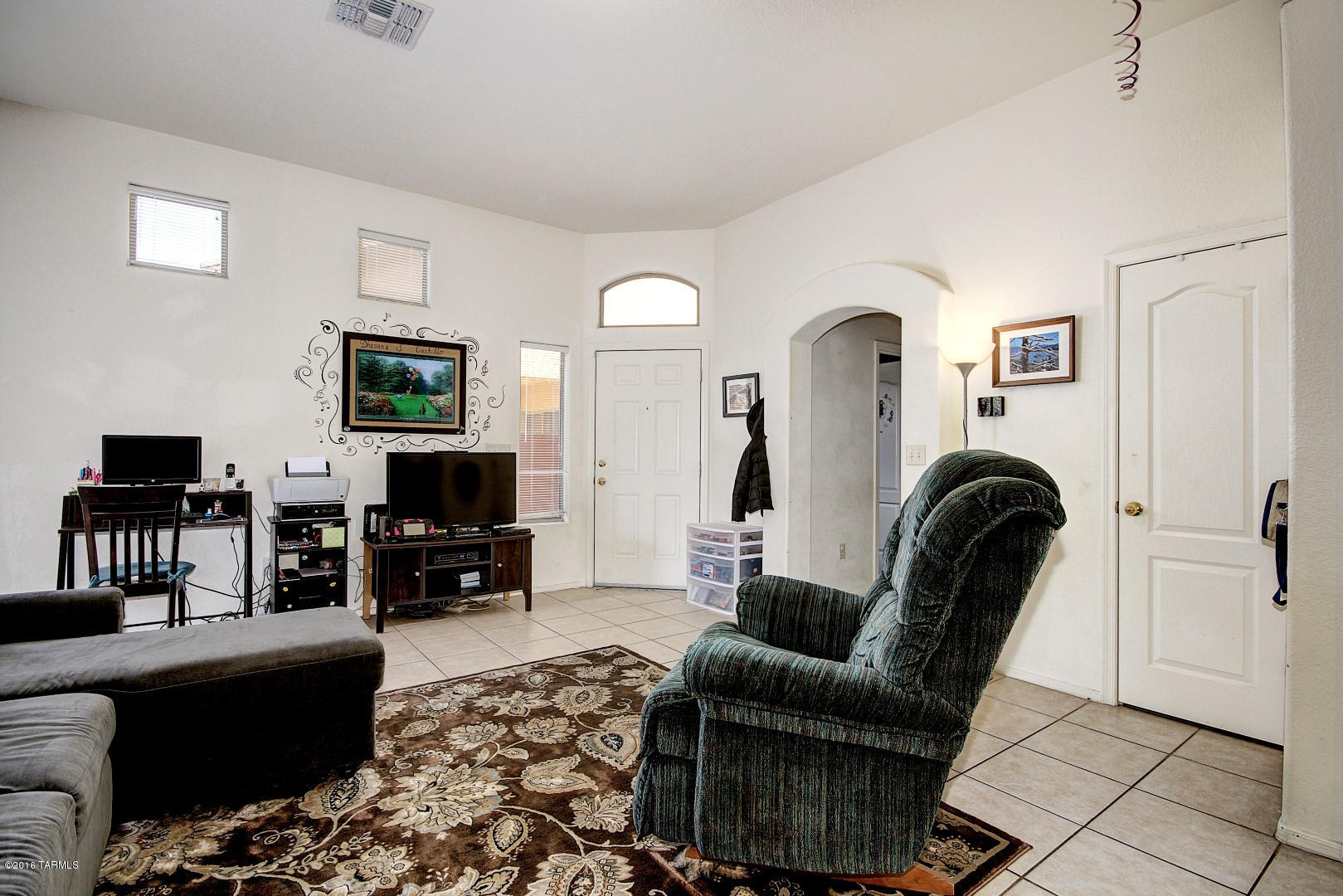 6016 South Avenida Ribero Tucson, AZ 85706 - Photo 4 of 15 a living room with furniture and a flat screen tv